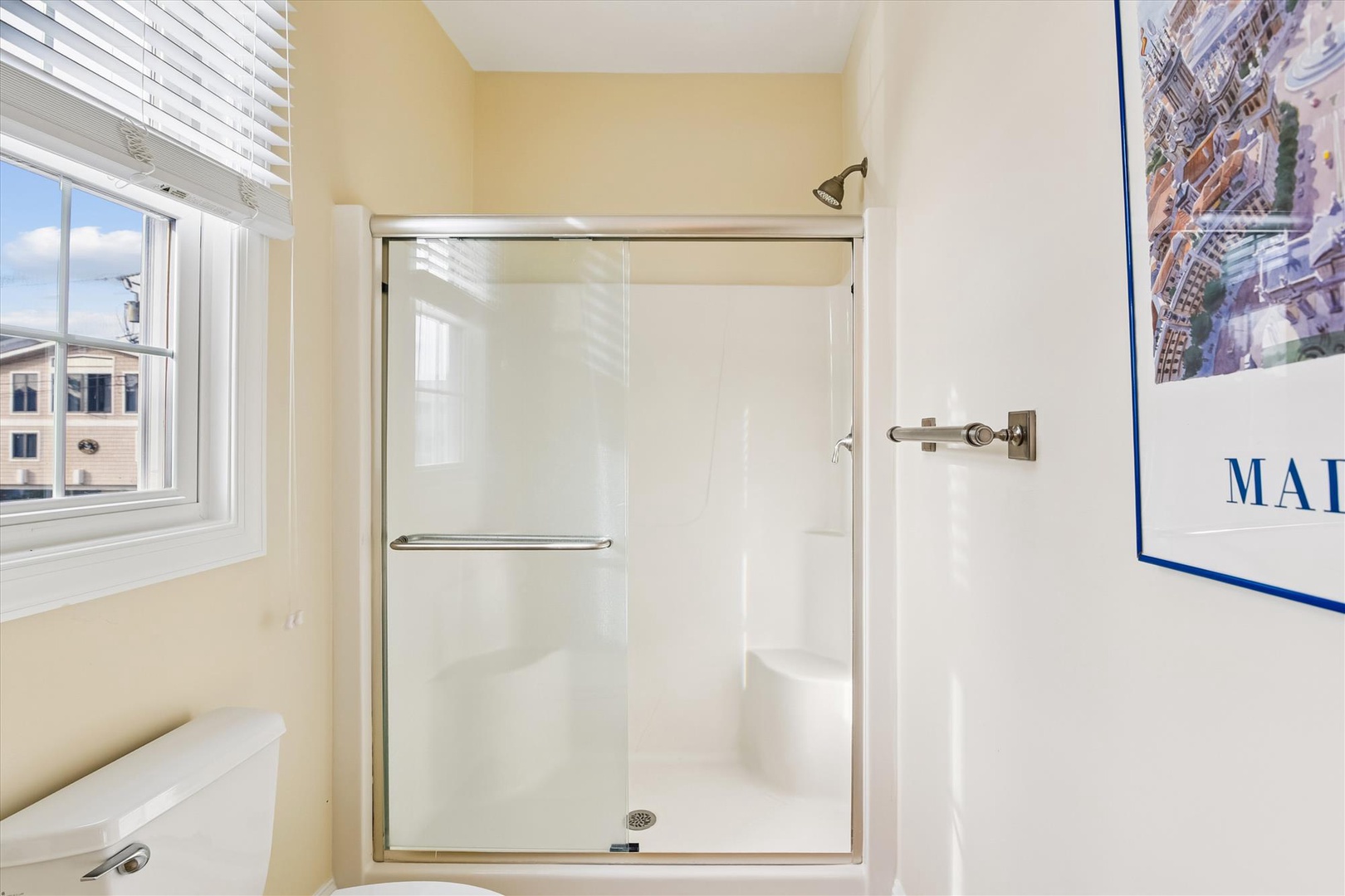 Step into your private spa-like retreat with a sparkling walk-in shower and bright, airy space perfect for refreshing after a day of exploring.