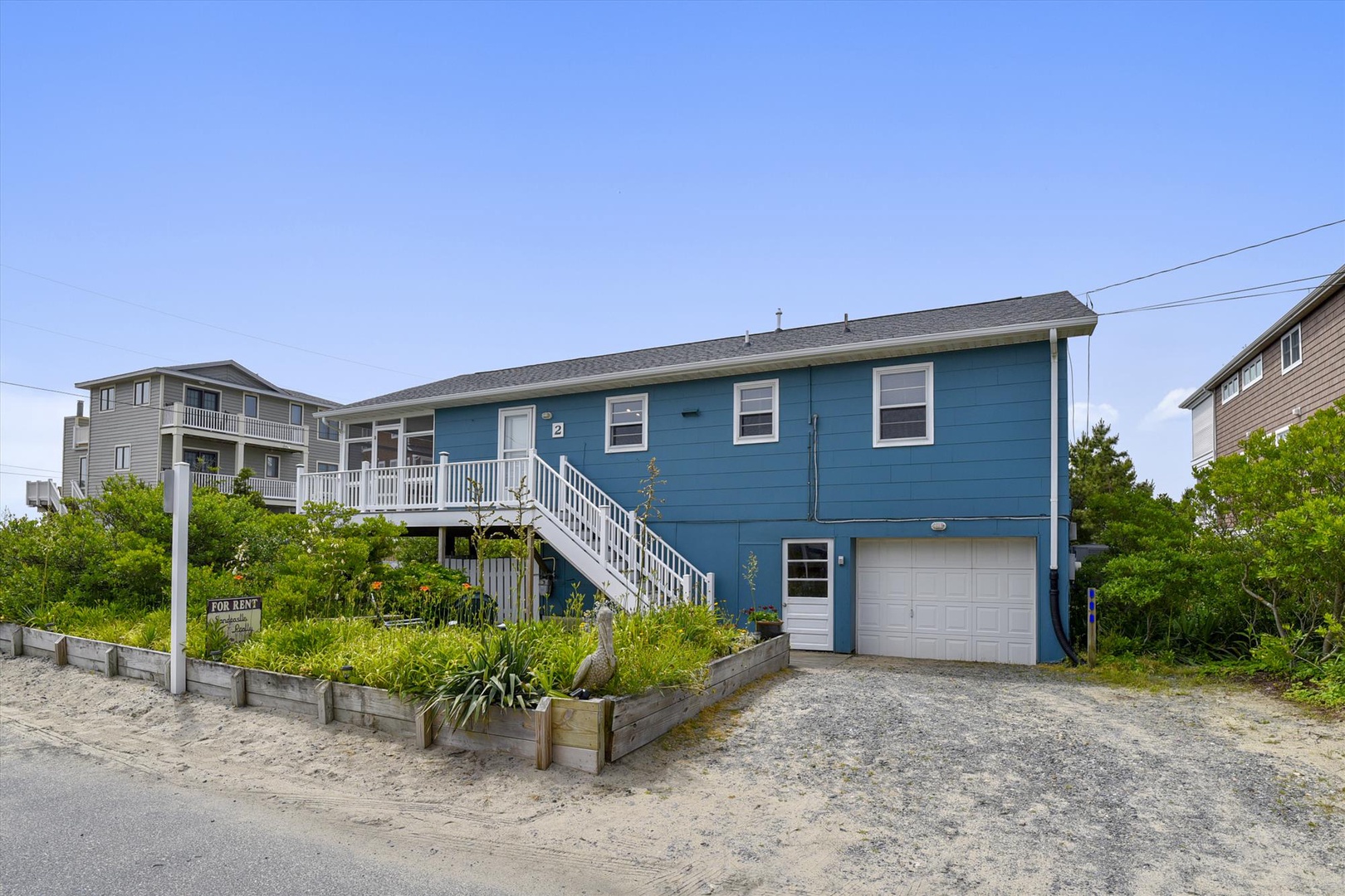 A charming coastal beach house with easy access to sandy shores, elevated design, and nearby neighbors—offering a relaxed arrival experience in a peaceful seaside neighborhood.