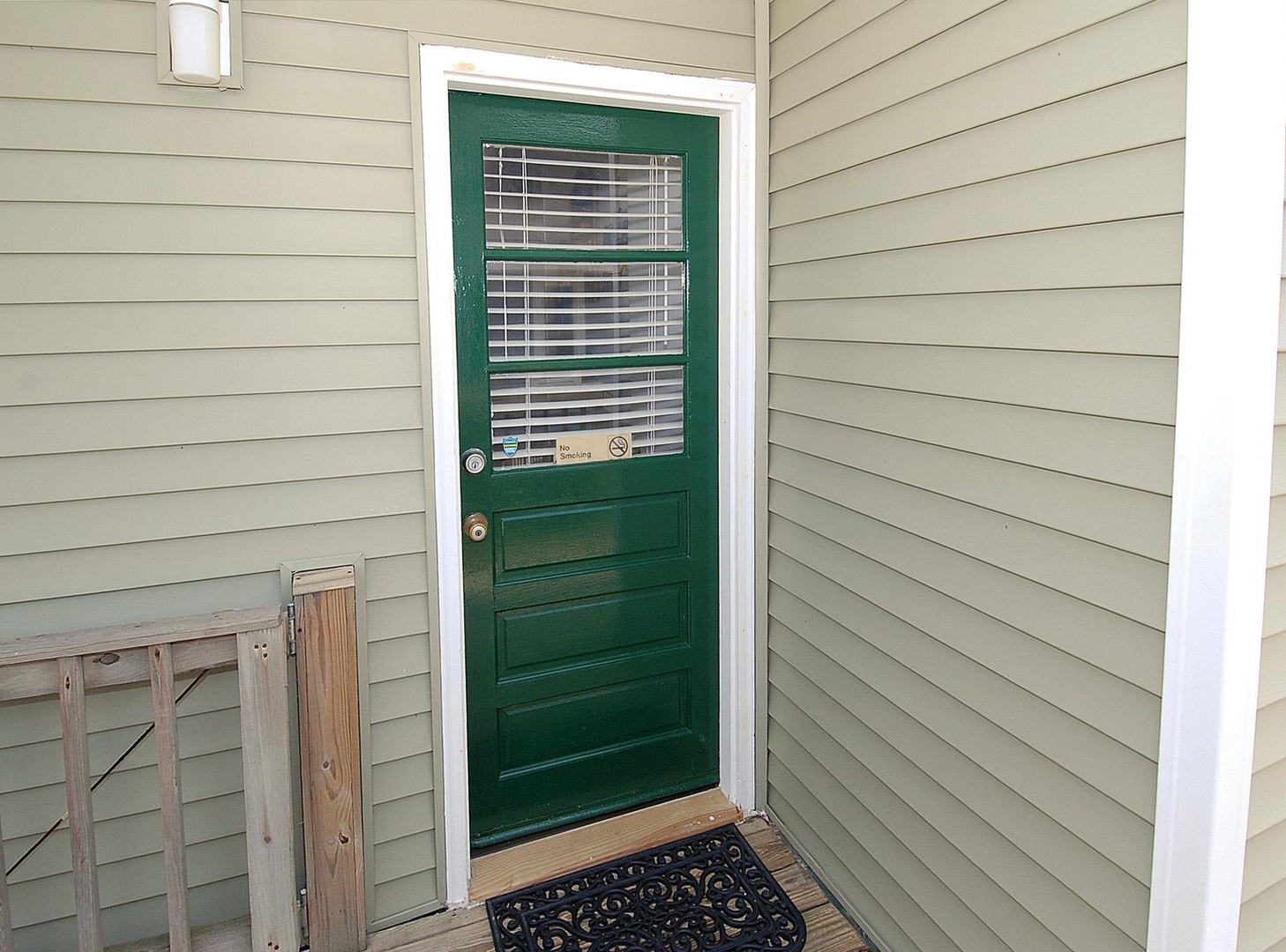 A welcoming green door marks the entrance to your private retreat, where your vacation begins the moment you arrive.