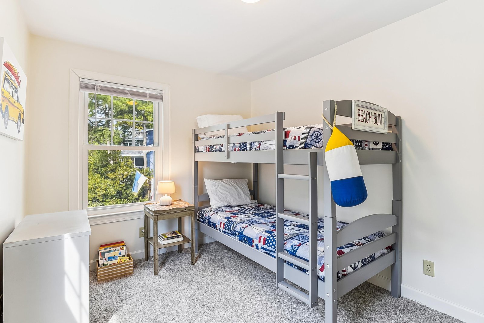 Your kids will love this cheerful beach-themed bunk room, with playful nautical touches and plenty of space for adventures together.