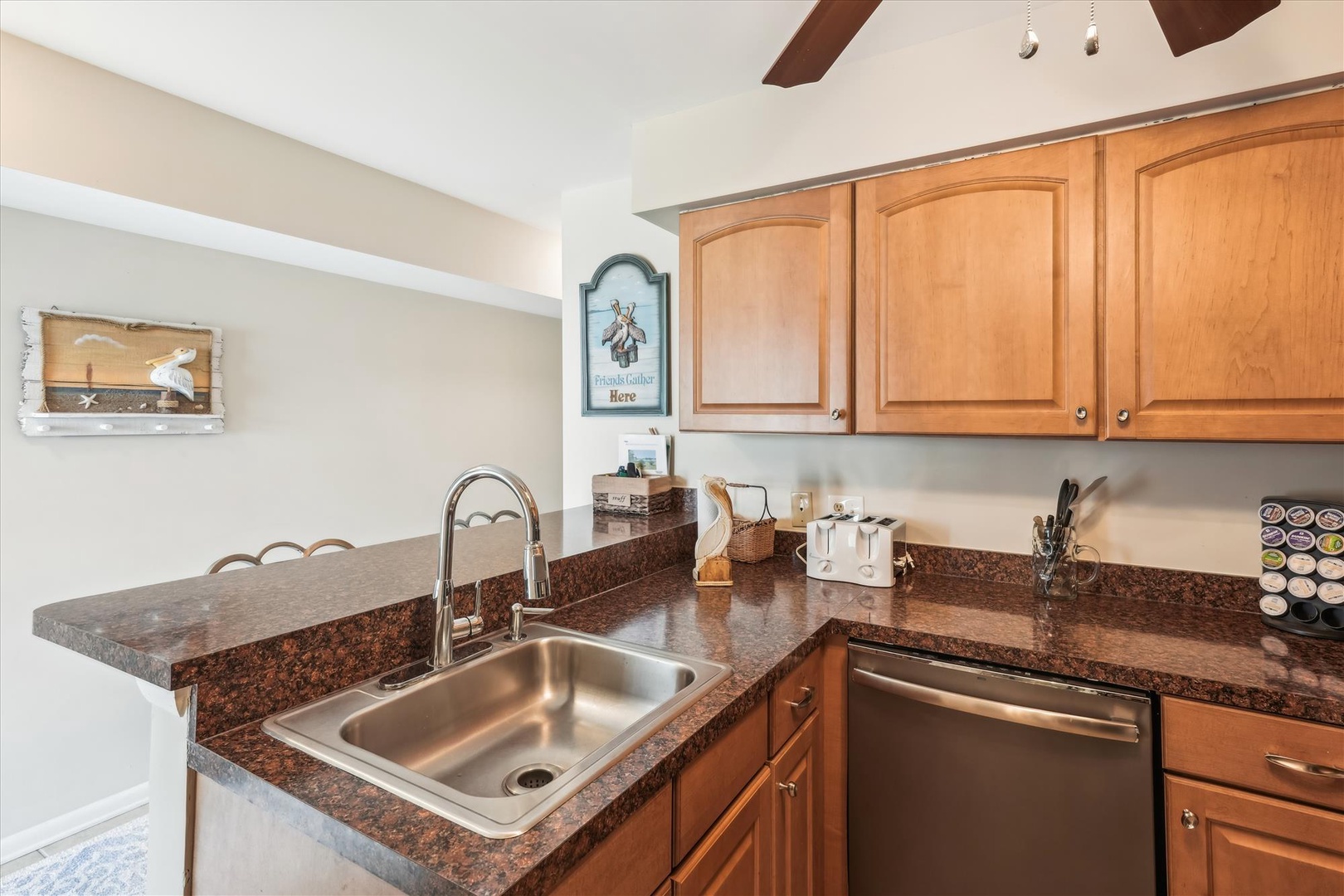 Your fully equipped kitchen features rich granite countertops, warm wood cabinetry, and modern appliances for preparing memorable meals.