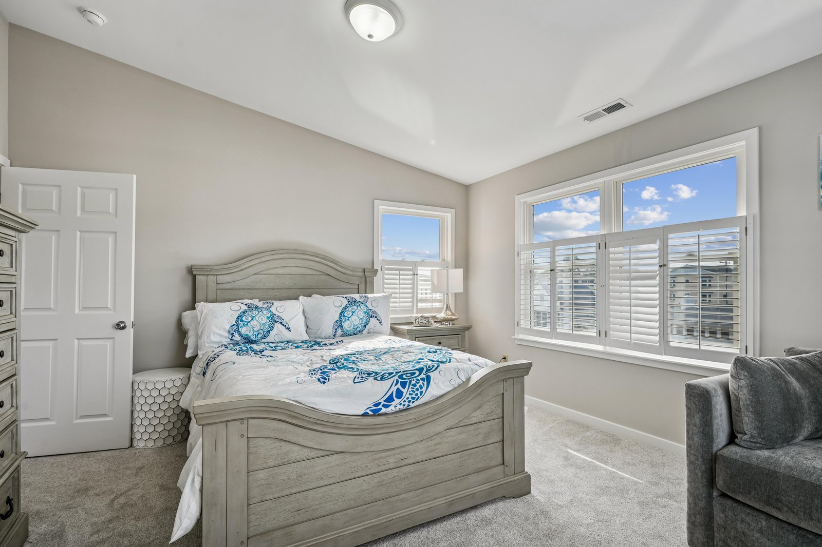 Drift off in your serene bedroom, where coastal-themed linens and soft natural light create the perfect retreat after a day of adventure.