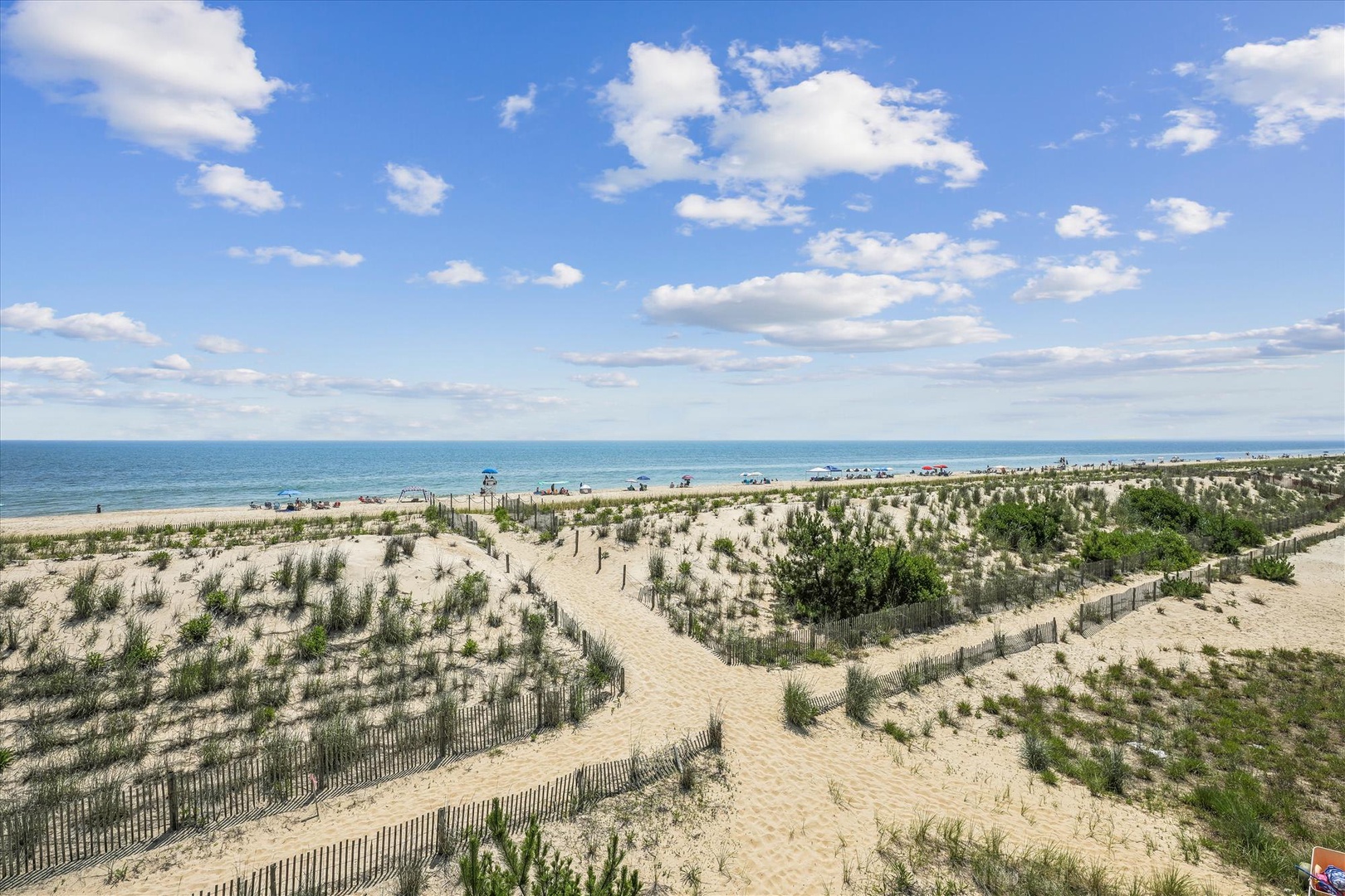 A pristine beachfront location featuring protected dunes and direct access to the sand and sea. The property sits in a tranquil coastal setting with preserved natural vegetation.