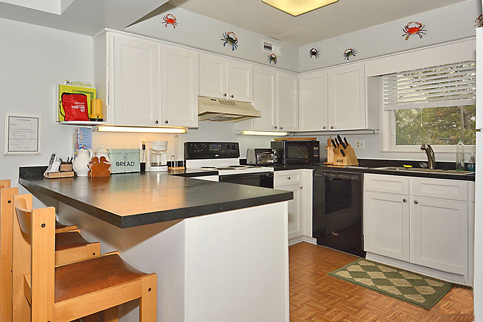 Your fully equipped kitchen features modern appliances, plenty of counter space, and a breakfast island perfect for prepping meals or enjoying casual dining with friends and family.