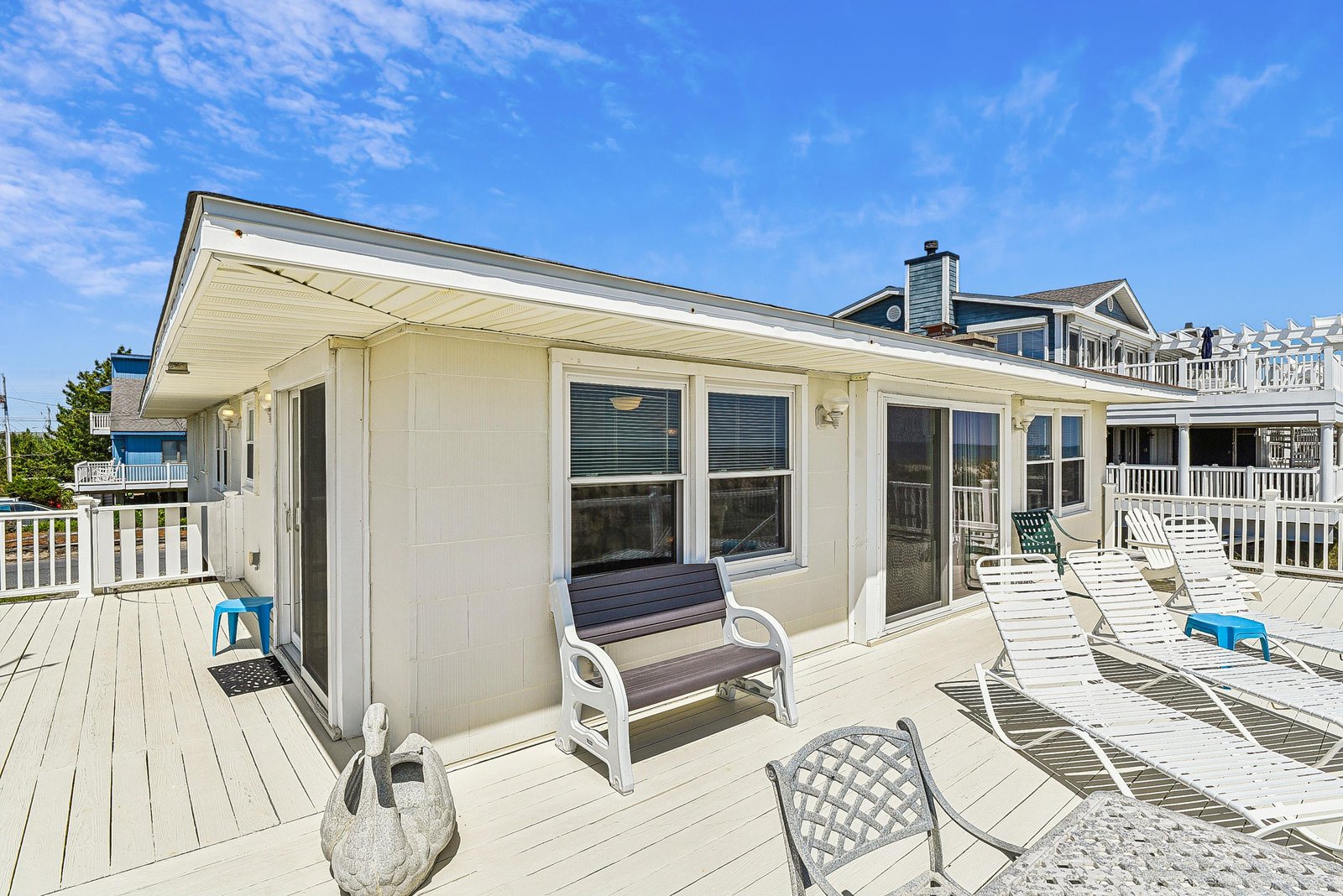 This spacious deck offers plenty of room to relax under the sun. Stretch out on a lounge chair and soak in the peaceful coastal atmosphere.