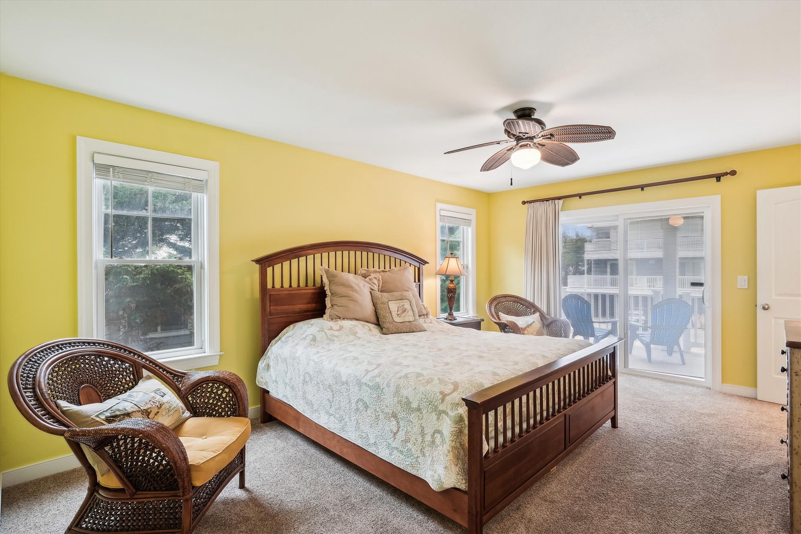 Wake to cheerful sunshine yellow walls and soft carpet beneath your feet. Your private balcony awaits just steps from your bed, perfect for morning coffee or evening breezes.