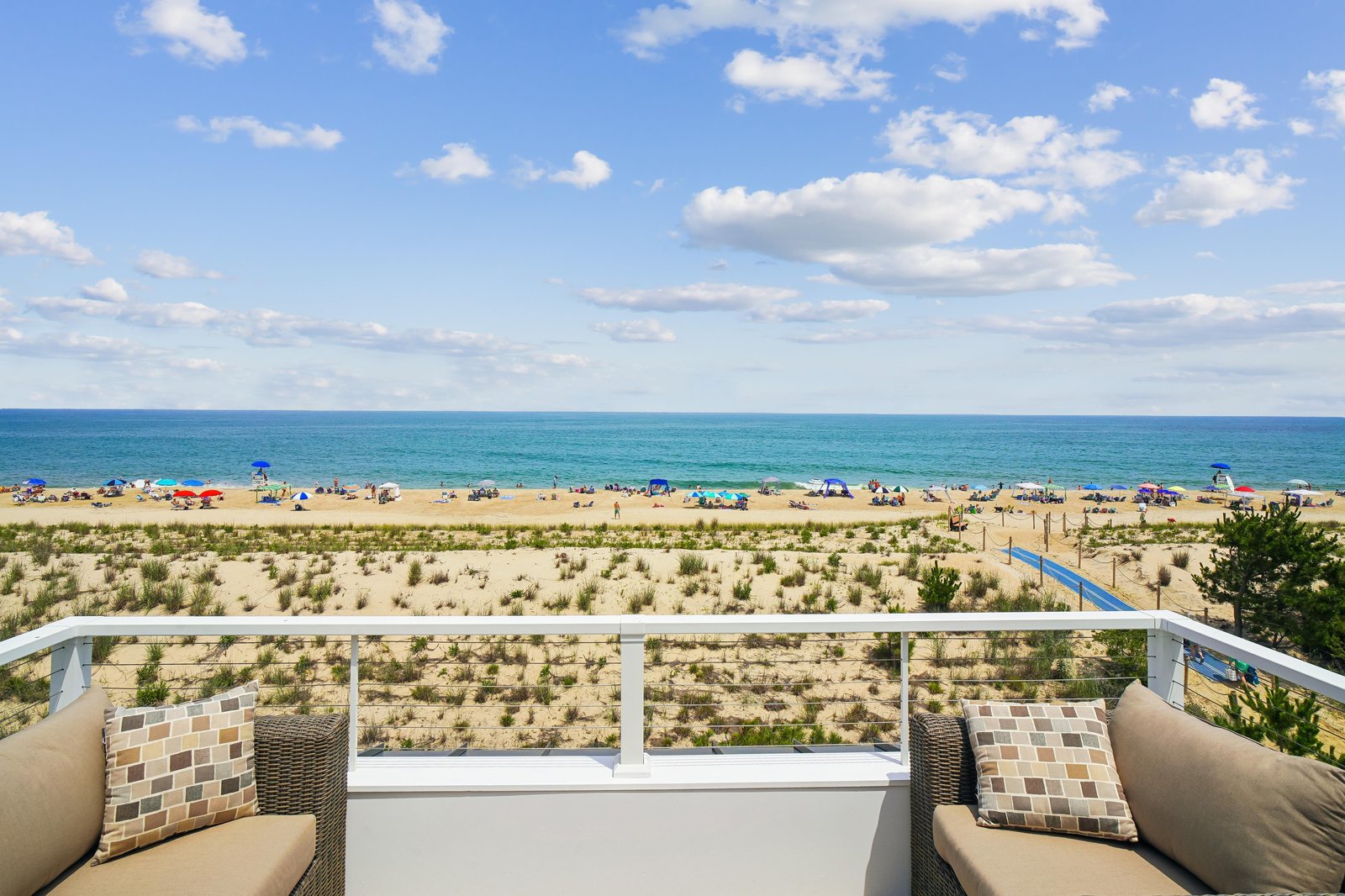 Your private balcony overlooks golden sands and turquoise waters, where gentle waves meet endless sky. Sink into plush seating and let the ocean breeze welcome you to pure coastal relaxation.