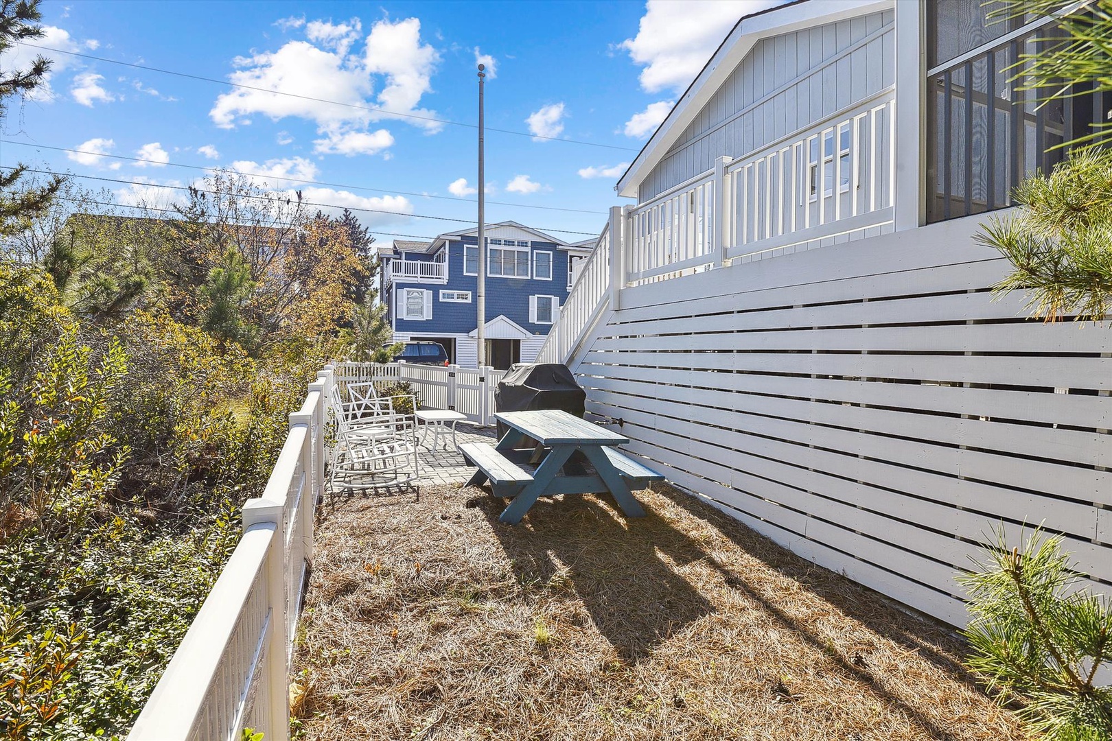 Relaxing outdoor space with a picnic table and lounge chairs where you can enjoy sunny afternoons and coastal breezes. Perfect for morning coffee or evening gatherings.