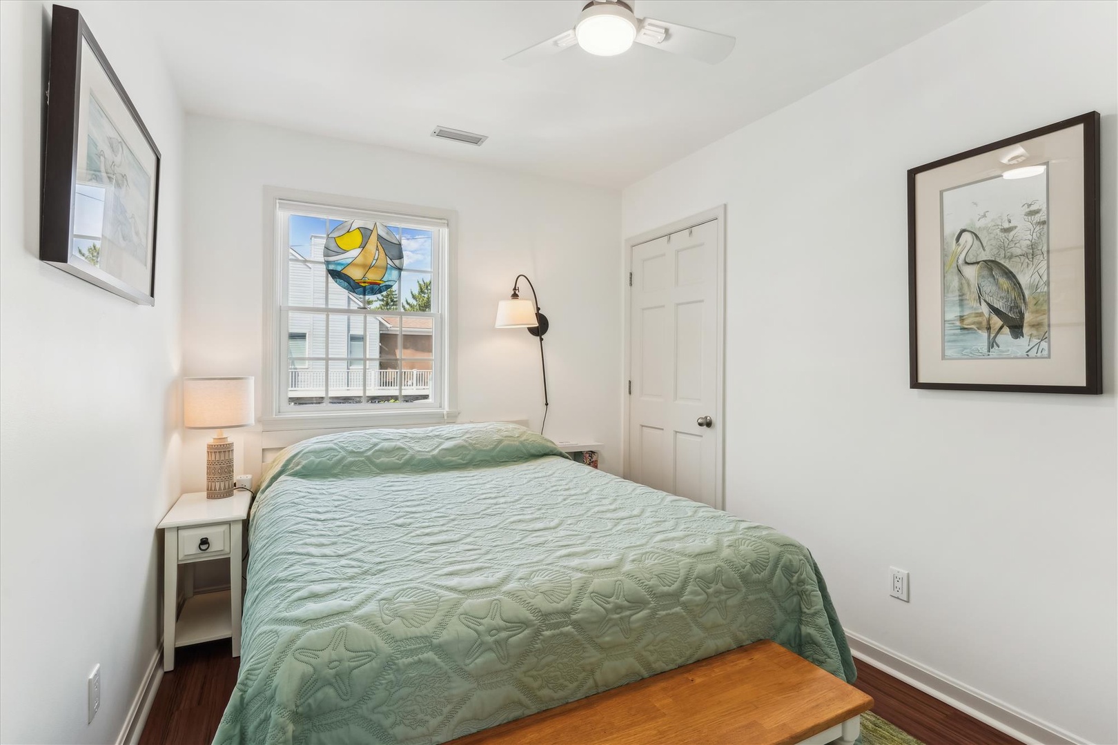 Step into your bright coastal retreat with calming seafoam linens, warm wood floors, and charming artwork inspired by nature. Soft lighting and a peaceful palette invite you to unwind completely.