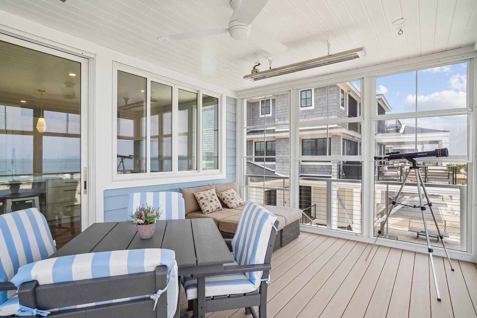 Settle into your private screened porch with coastal breezes and ocean views, perfect for morning coffee or evening relaxation with the soothing sound of nearby waves.