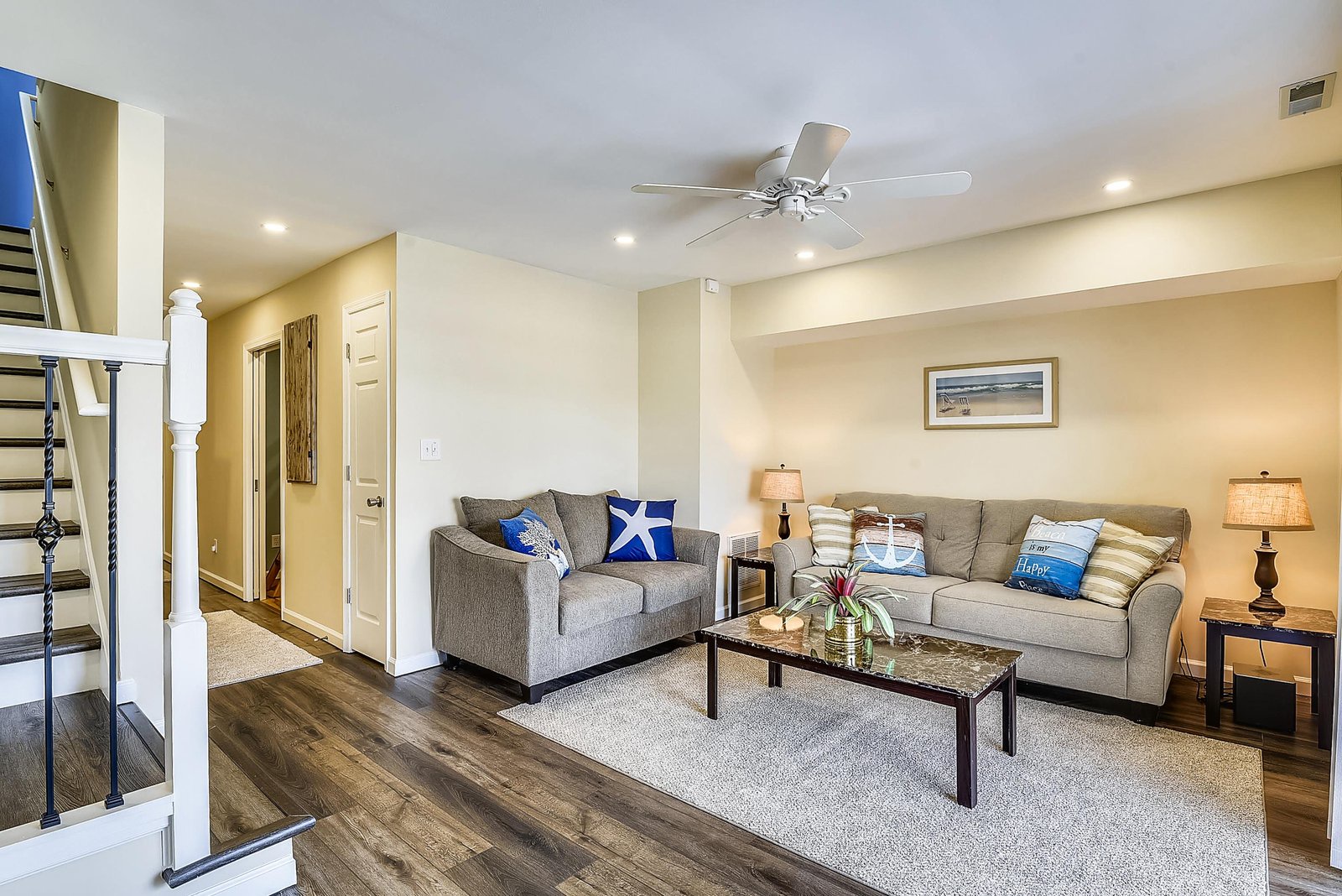 Sink into the plush sofas and unwind in your inviting living space, where coastal-inspired accents and soft lighting create the perfect atmosphere for relaxing after a day of adventures.