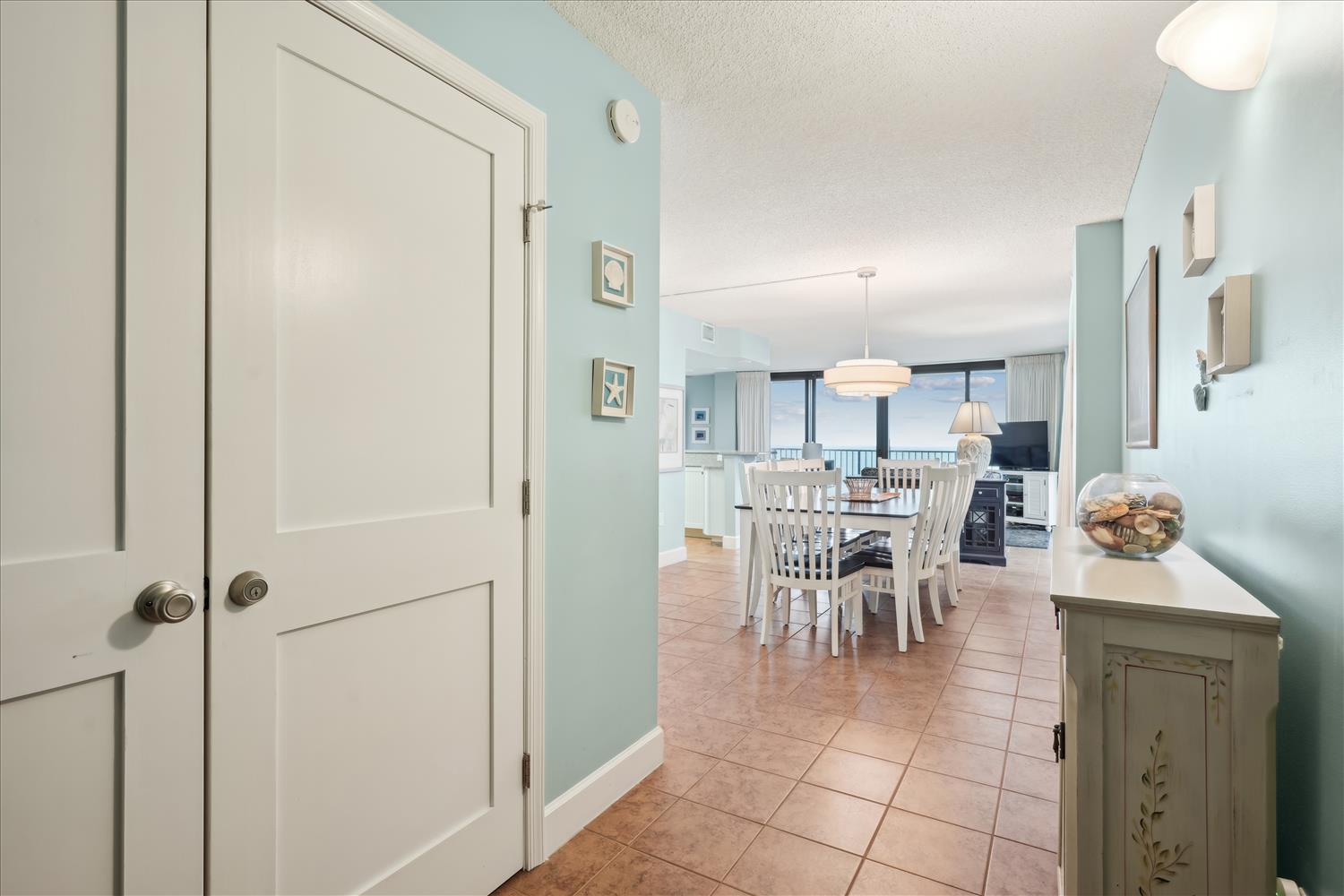 Step into your coastal retreat where soft aqua walls and coastal charm welcome you. The open layout flows seamlessly into a spacious dining area, perfect for gathering with loved ones.