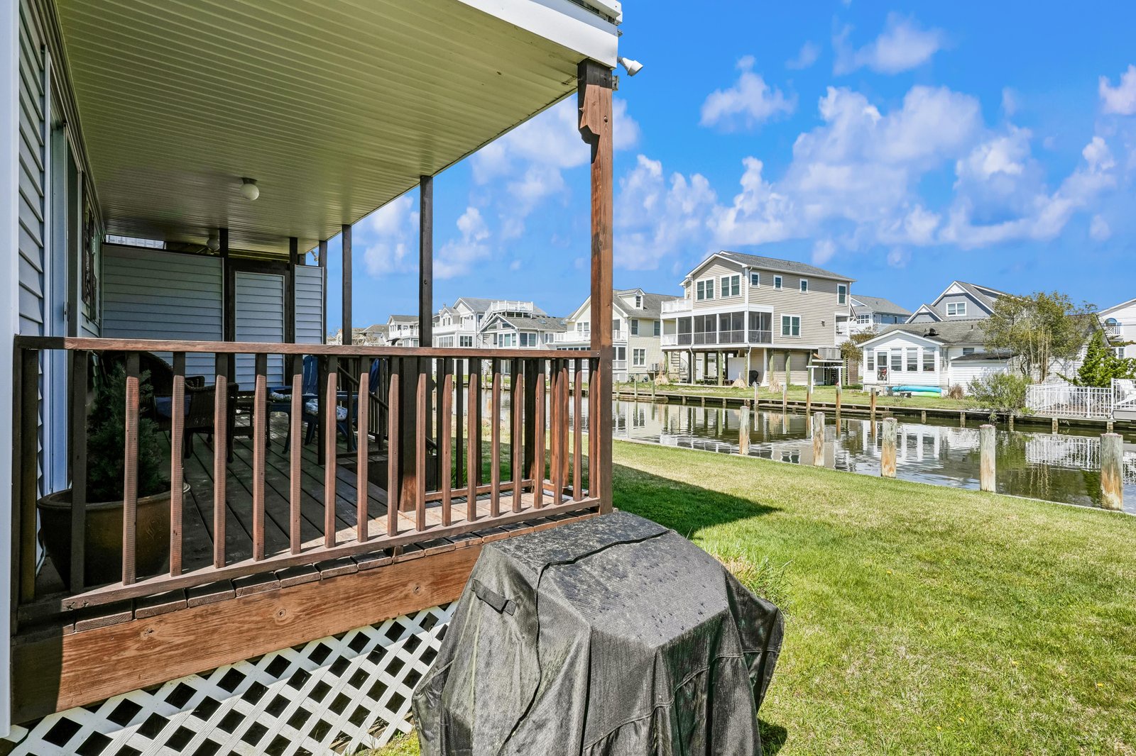 A tranquil waterfront location situated in a peaceful residential community with canal access. The property is part of a waterside neighborhood with nearby homes, boat docks, and a serene setting ideal for those seeking a calm getaway.