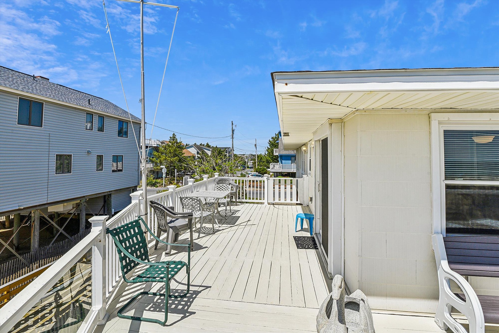Enjoy coastal breezes and sunny mornings on this spacious deck, perfect for your morning coffee or alfresco dining as beach days unfold around you.