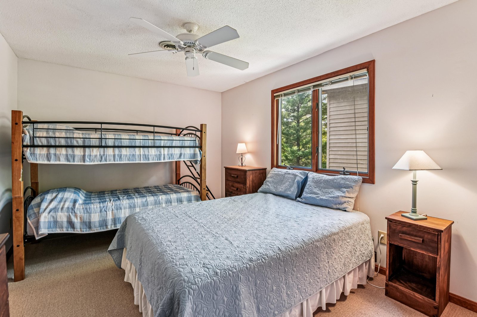 Rest easy in your private bedroom, where a comfortable queen bed and cozy bunk bed accommodate the whole family, and a ceiling fan keeps the air fresh and cool.