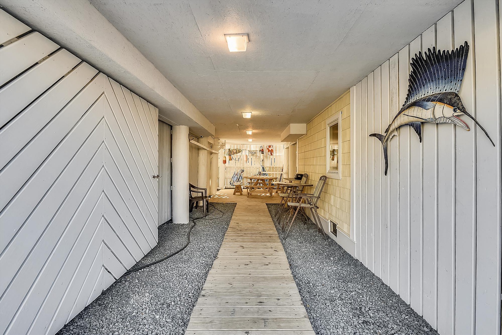 Step through this coastal-inspired entrance and into your relaxing beach retreat, where nautical décor welcomes you to a peaceful home away from home.