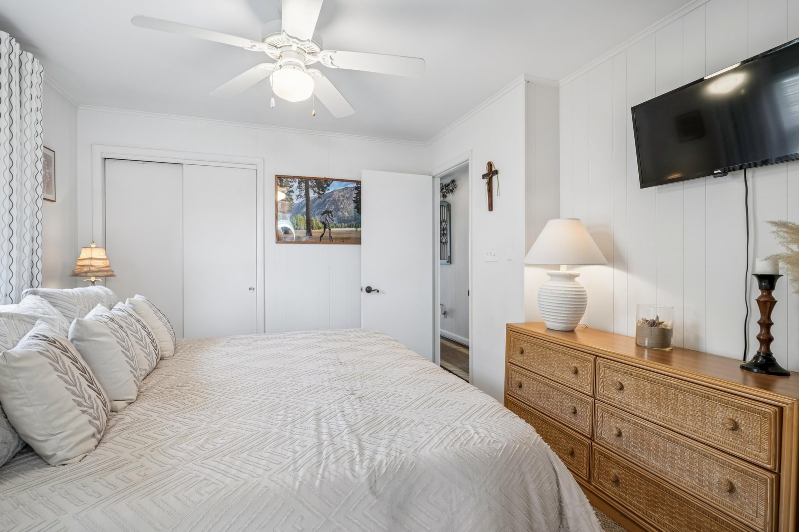 Drift into a restful sleep in your serene bedroom, where soft linens, a gentle ceiling fan, and warm lighting create the perfect retreat after a day of adventure.