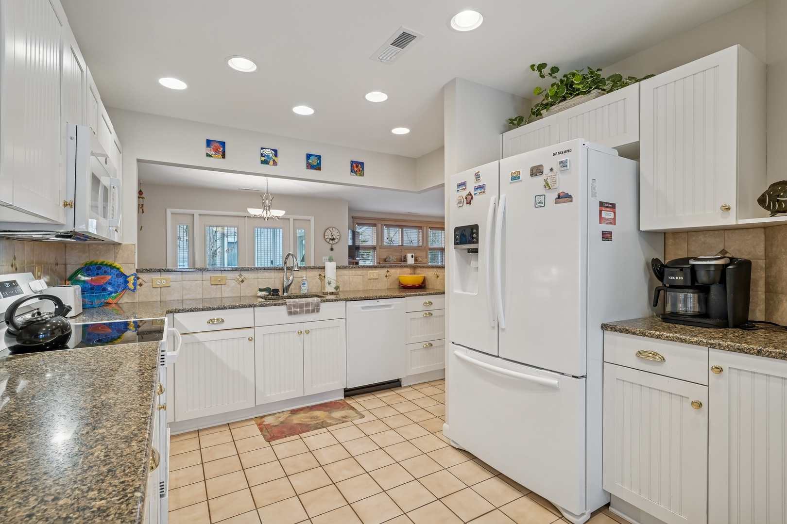 Your spacious kitchen invites culinary adventures with granite countertops, modern appliances, and plenty of prep space for memorable meals together.
