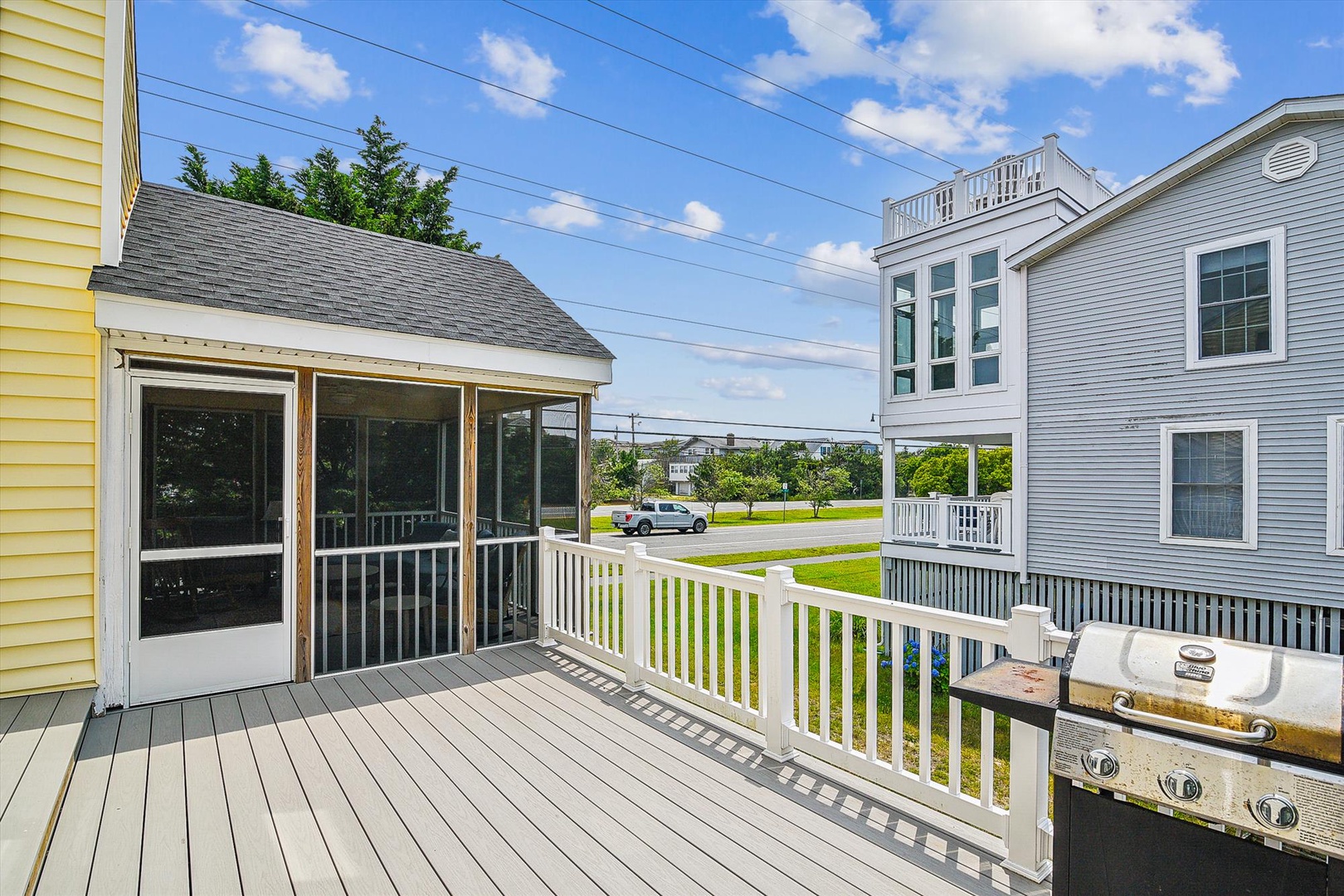 A private deck with a gas grill provides the perfect outdoor cooking and dining space. The screened porch offers comfortable, bug-free relaxation while enjoying neighborhood views.