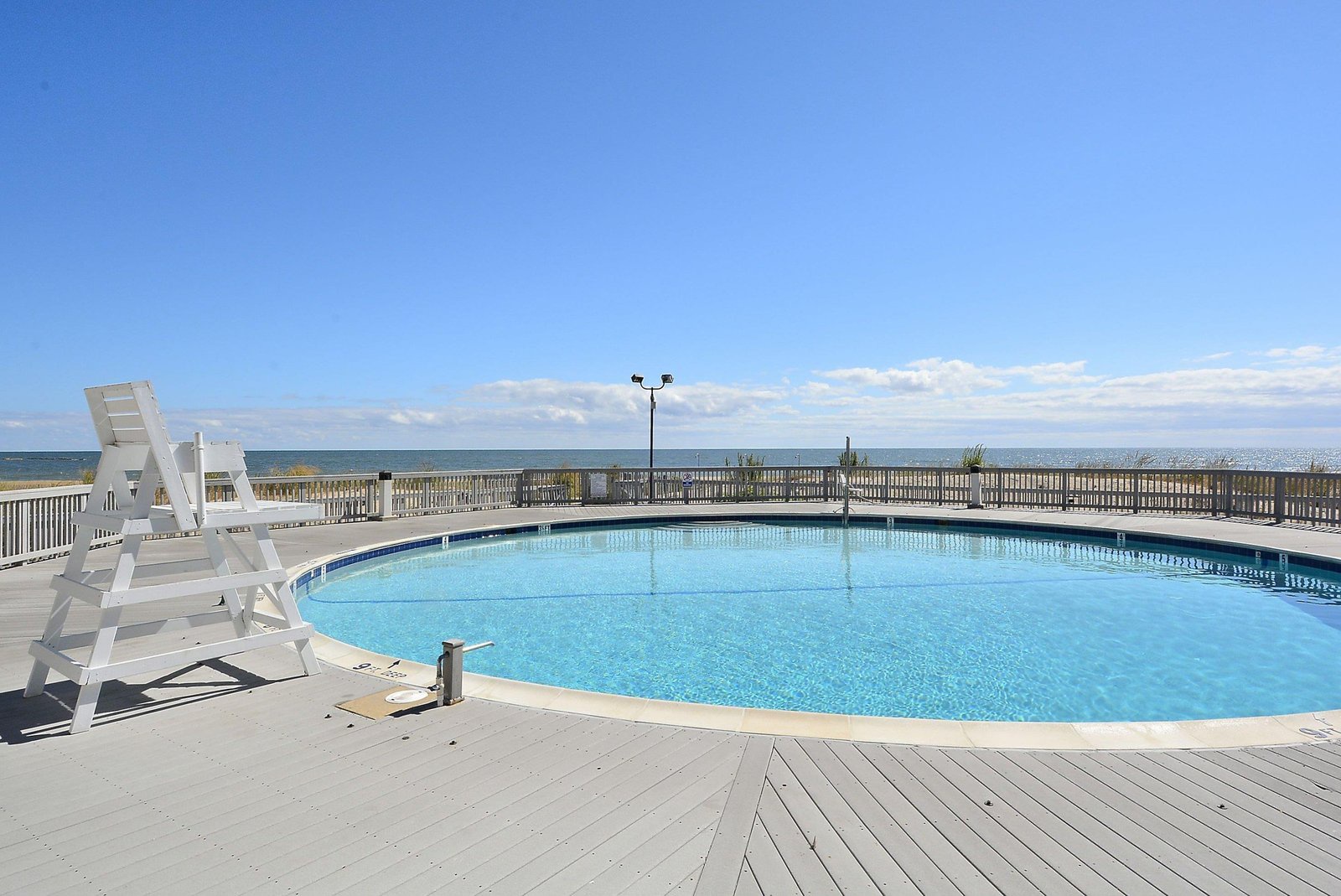 This beachfront pool offers crystal-clear waters and serene ocean horizons—your perfect spot to unwind under open skies with the sea just beyond.