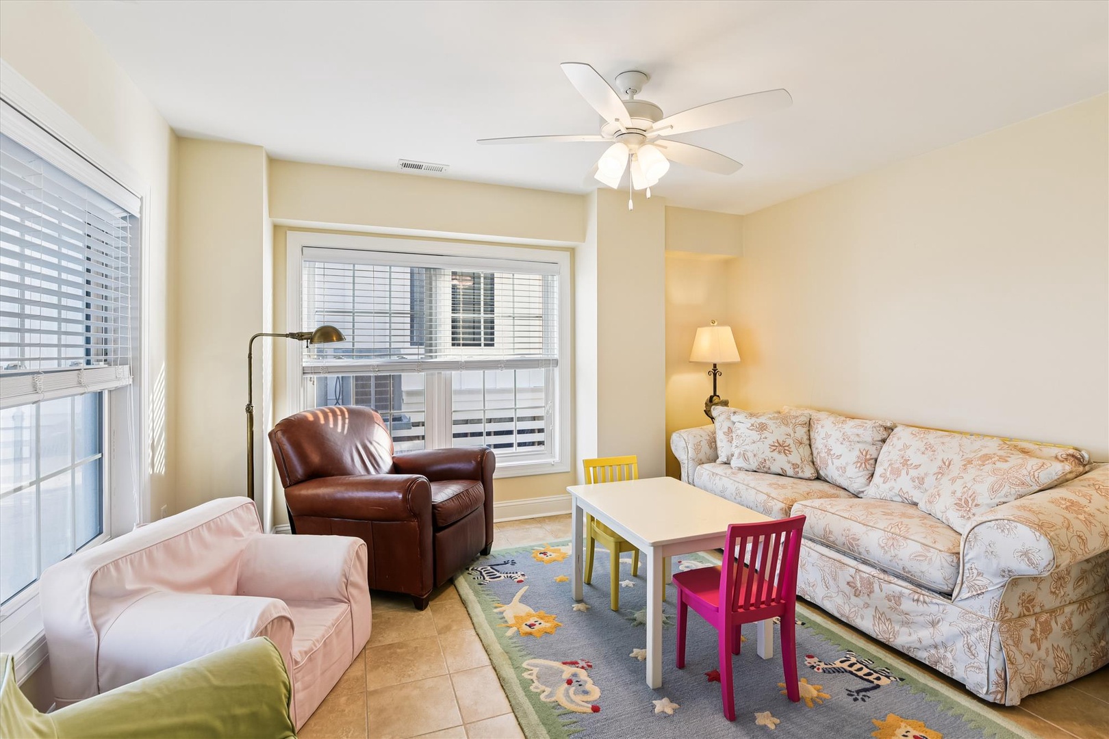 Curl up on the plush sofas with a good book, or let the little ones enjoy their own play space at the kids' table. Soft lighting and gentle ceiling fan breezes keep things cozy year-round.