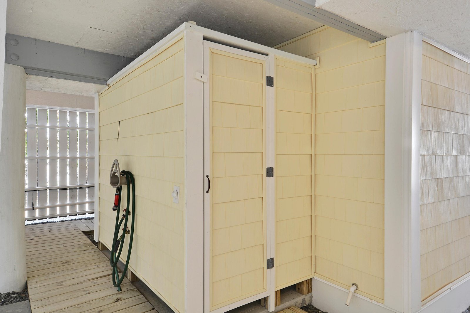 A spacious outdoor storage shed beneath the home keeps your beach gear, bikes, and essentials organized and close at hand.
