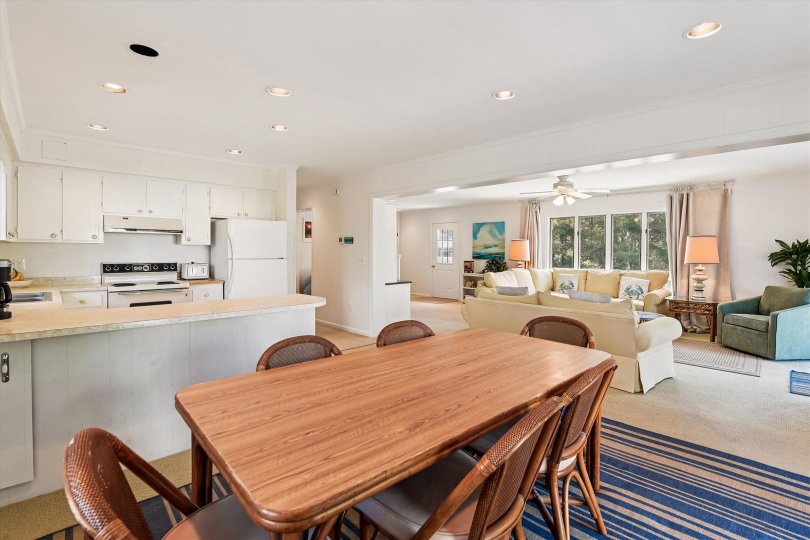 Your open-concept haven flows seamlessly from kitchen to dining to living room, perfect for gathering with loved ones in bright, comfortable style.