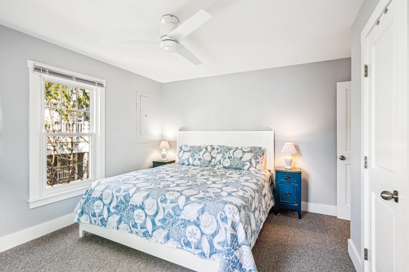 Your peaceful bedroom features soft blue accents and a plush bed where you can unwind after each day of exploring.