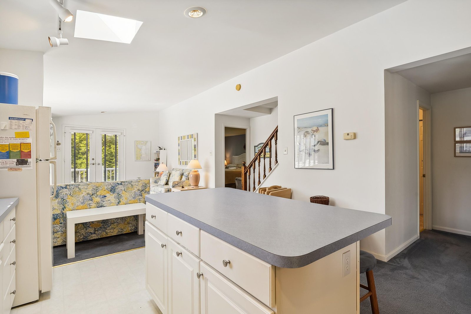 Bright, open living space where your kitchen island flows into the cozy seating nook—perfect for morning coffee or planning your day's adventures.