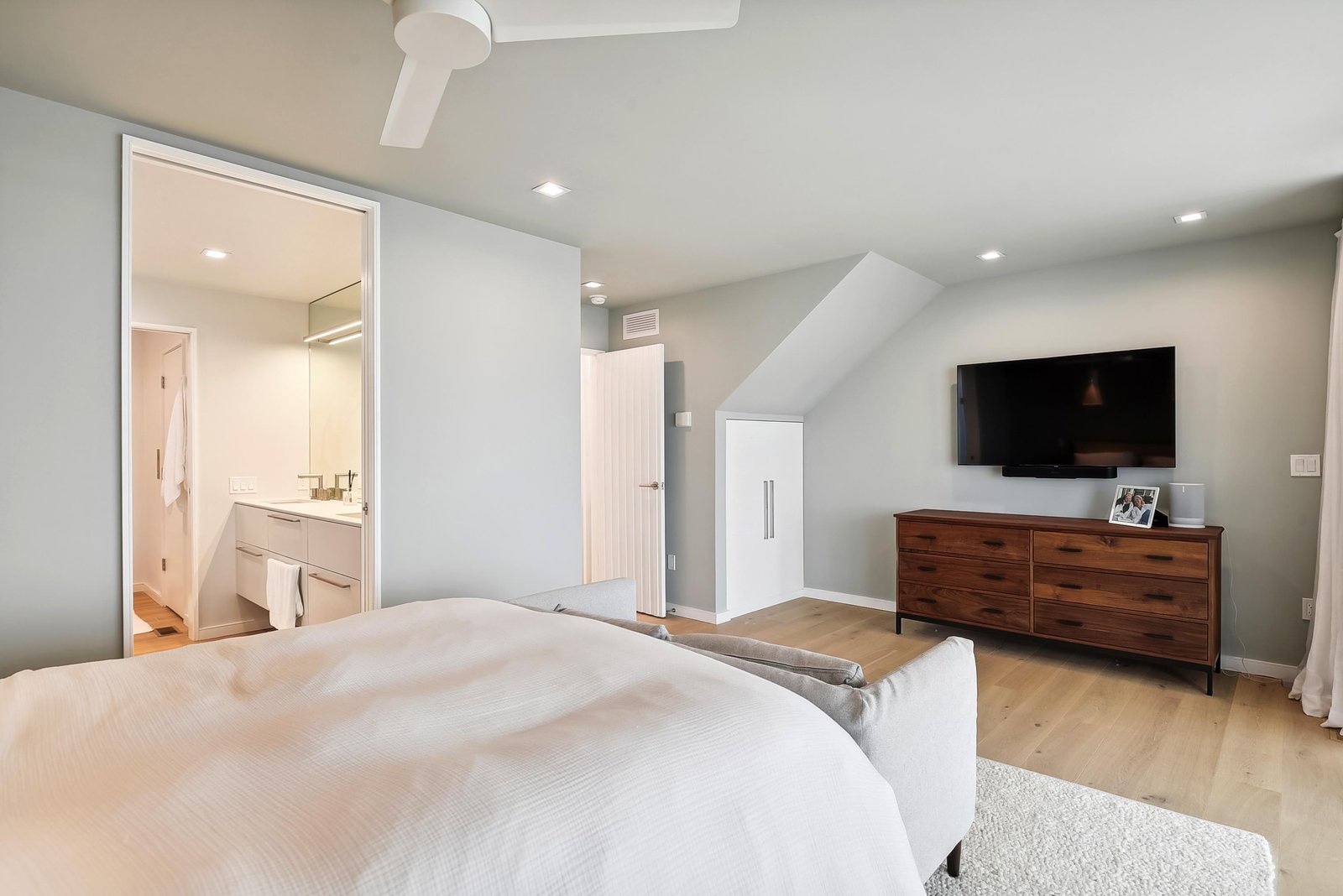 Unwind in your serene bedroom where modern comfort meets tranquil style. Soft lighting, a plush bed, and an ensuite bath create your perfect retreat after a day of adventure.