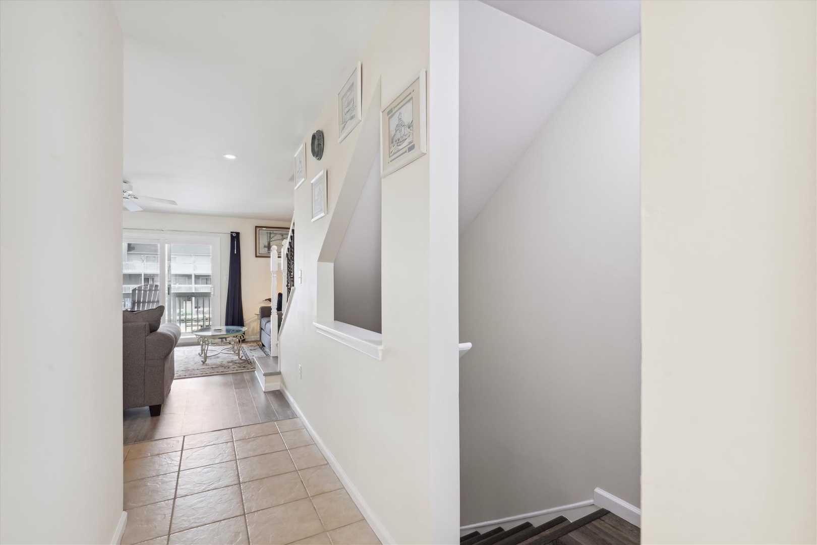 This welcoming entryway opens into your bright, thoughtfully designed space, where natural light and comfortable furnishings invite you to settle in and relax after a day of exploring.