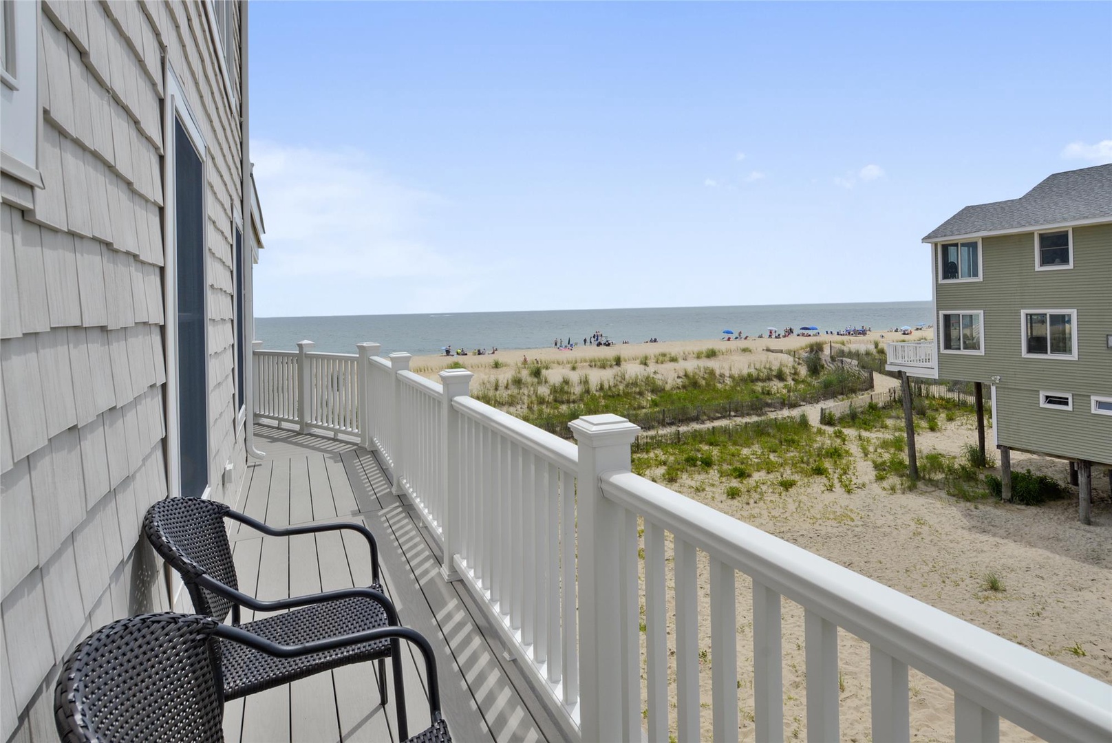 Picture yourself on your private balcony with a morning coffee, gazing over sandy dunes to the sparkling ocean just steps away—your beachside retreat awaits.