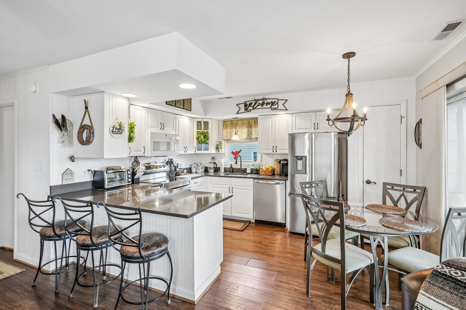 Your fully-equipped kitchen awaits, complete with modern appliances, a spacious island for gathering, and warm lighting that makes every meal feel special.