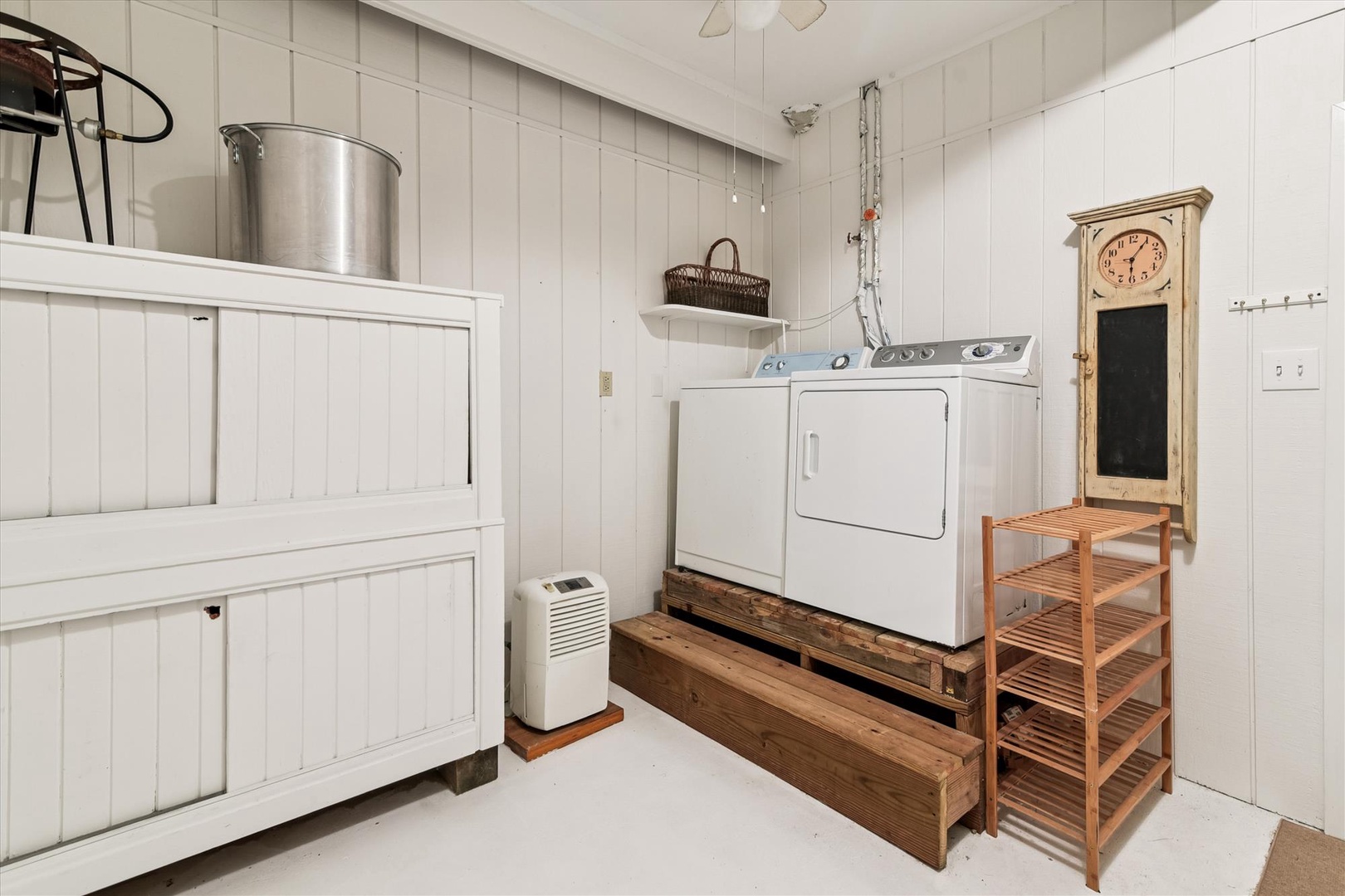 Your private laundry room keeps travel light with a full washer and dryer, plus charming farmhouse storage for all your essentials.