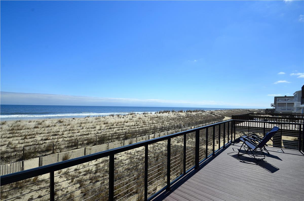 Your private deck stretches out toward the ocean, where gentle dunes frame endless blue water. Pull up a chair, breathe in the salt air, and let the sound of the waves become your soundtrack.