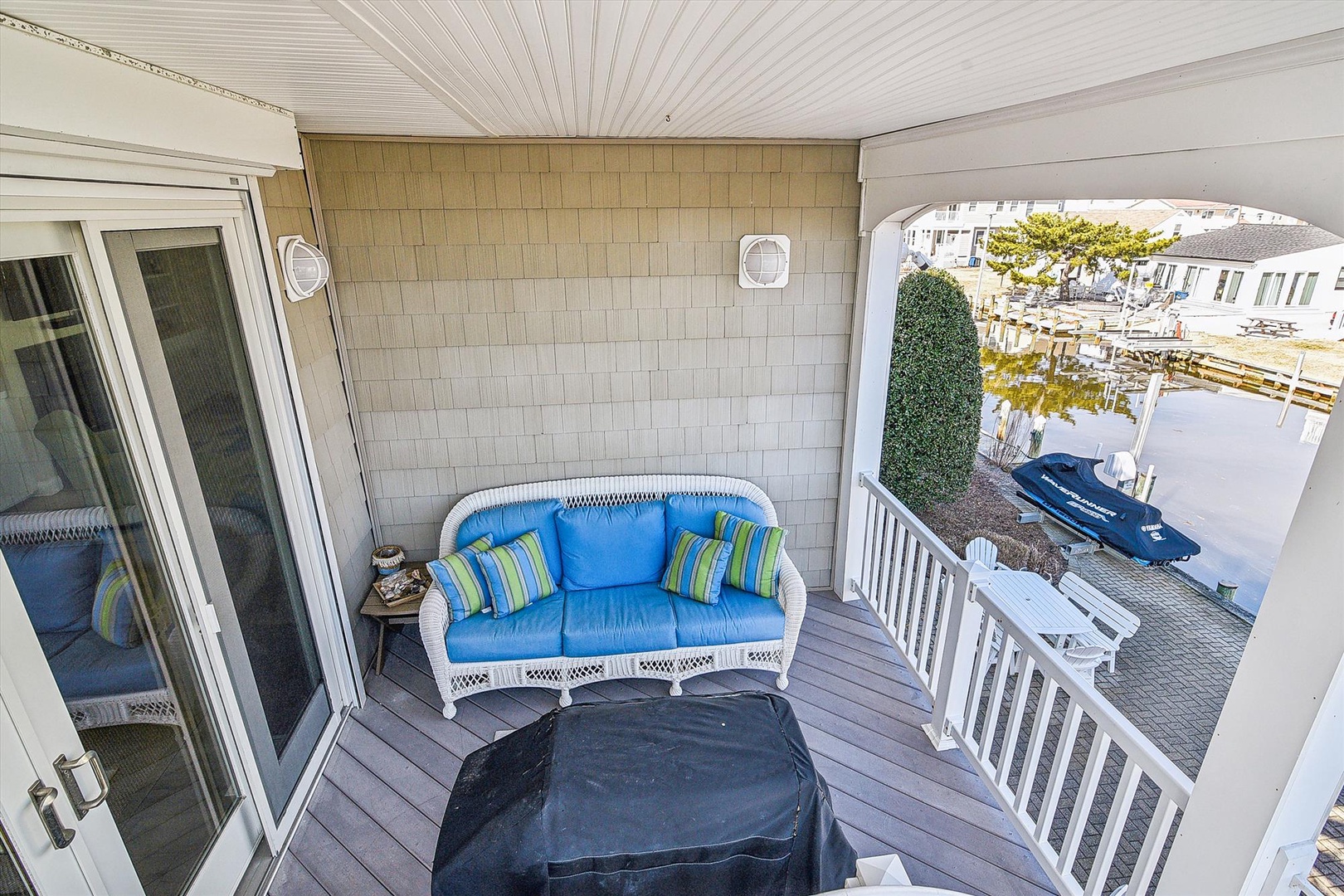 Unwind on your private balcony with comfortable seating while enjoying canal views and waterfront charm.