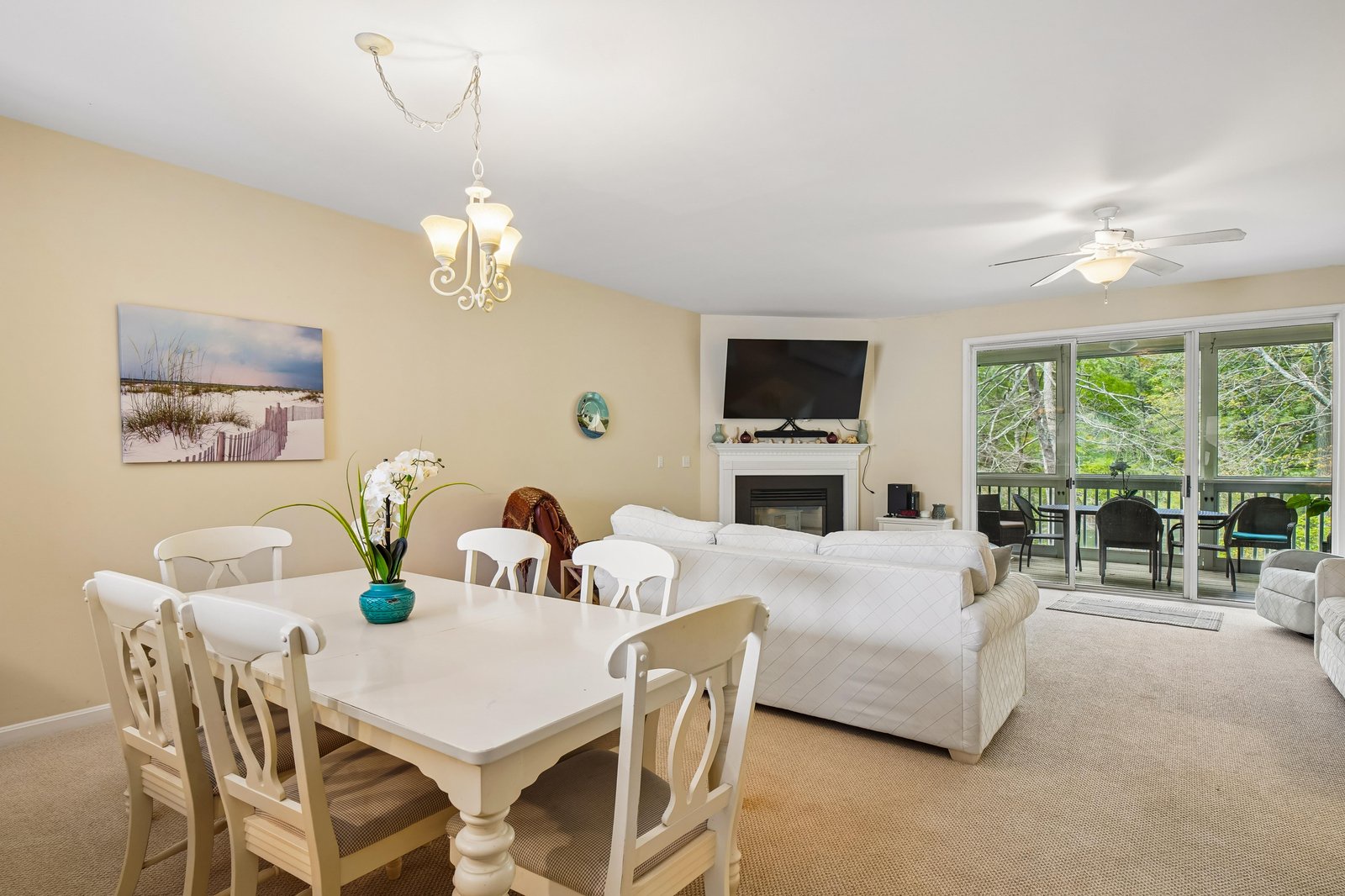 Unwind in your spacious living area where coastal charm meets comfort—sink into the sofa, gather for meals at the dining table, or step onto the balcony to enjoy lush garden views.