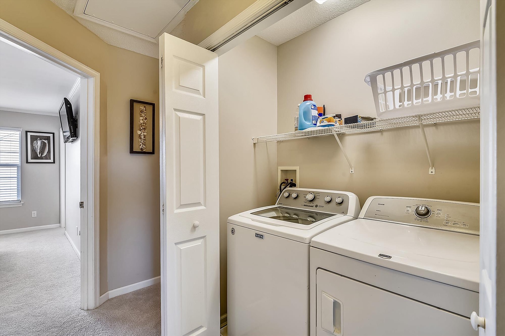 You'll find a convenient in-unit washer and dryer tucked into a clean, well-organized laundry closet—making it easy to keep your clothes fresh without ever leaving your rental.
