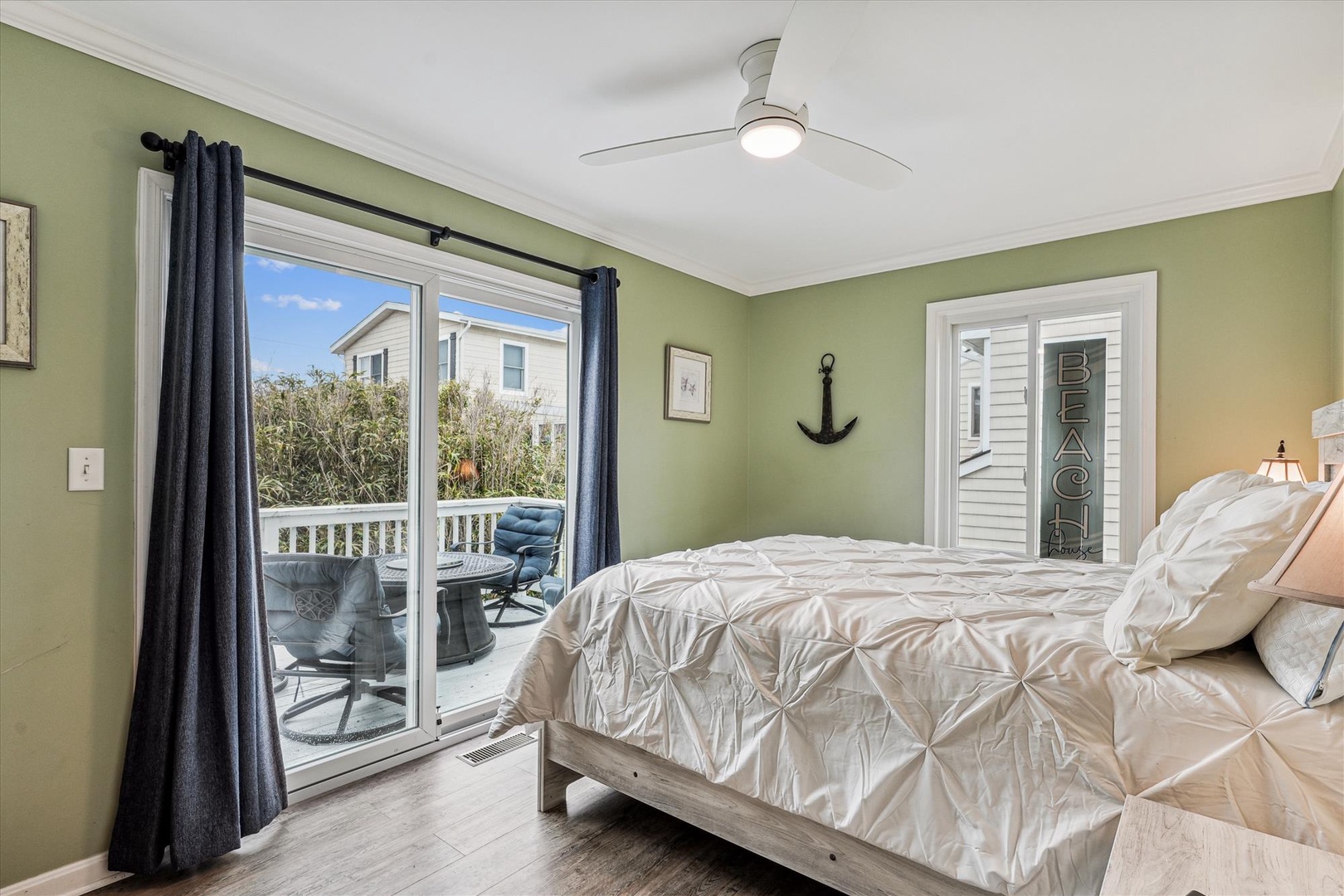 Wake up to soft coastal breezes and natural light streaming through your private balcony doors. Sink into plush bedding in this peaceful retreat, styled with calming beach-inspired touches to help you unwind.