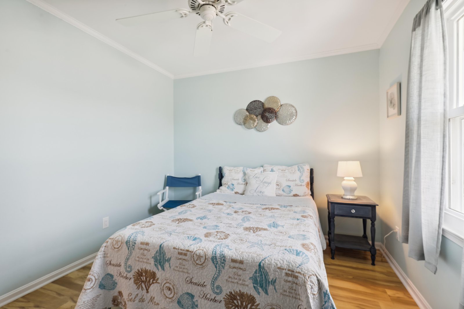 Your coastal-inspired retreat awaits with soothing sea colors, soft linens, and charming nautical details that'll help you drift into peaceful nights.
