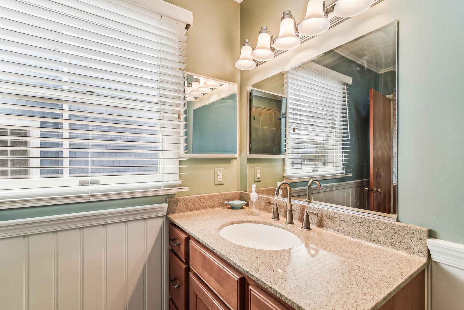 Refresh in your beautifully appointed bathroom, where natural light and elegant fixtures create a calming retreat for your daily routines.