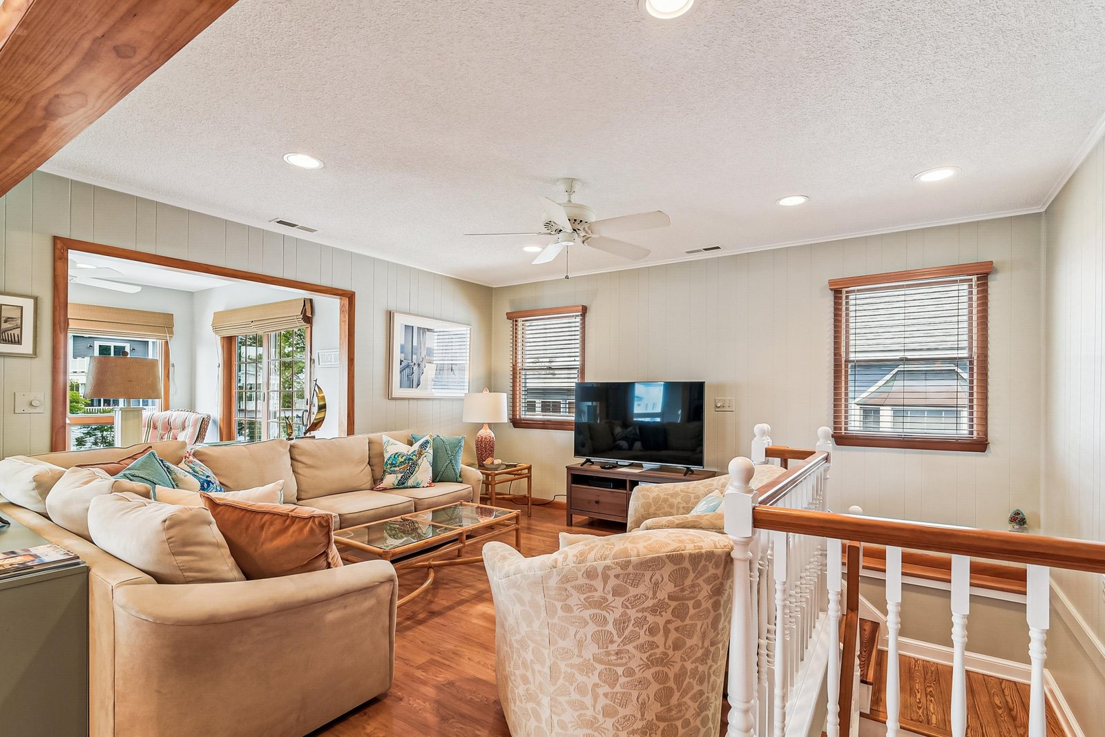 Kick back in your spacious upstairs living area, complete with plush seating, warm wood accents, and an open layout perfect for gathering with family and friends.