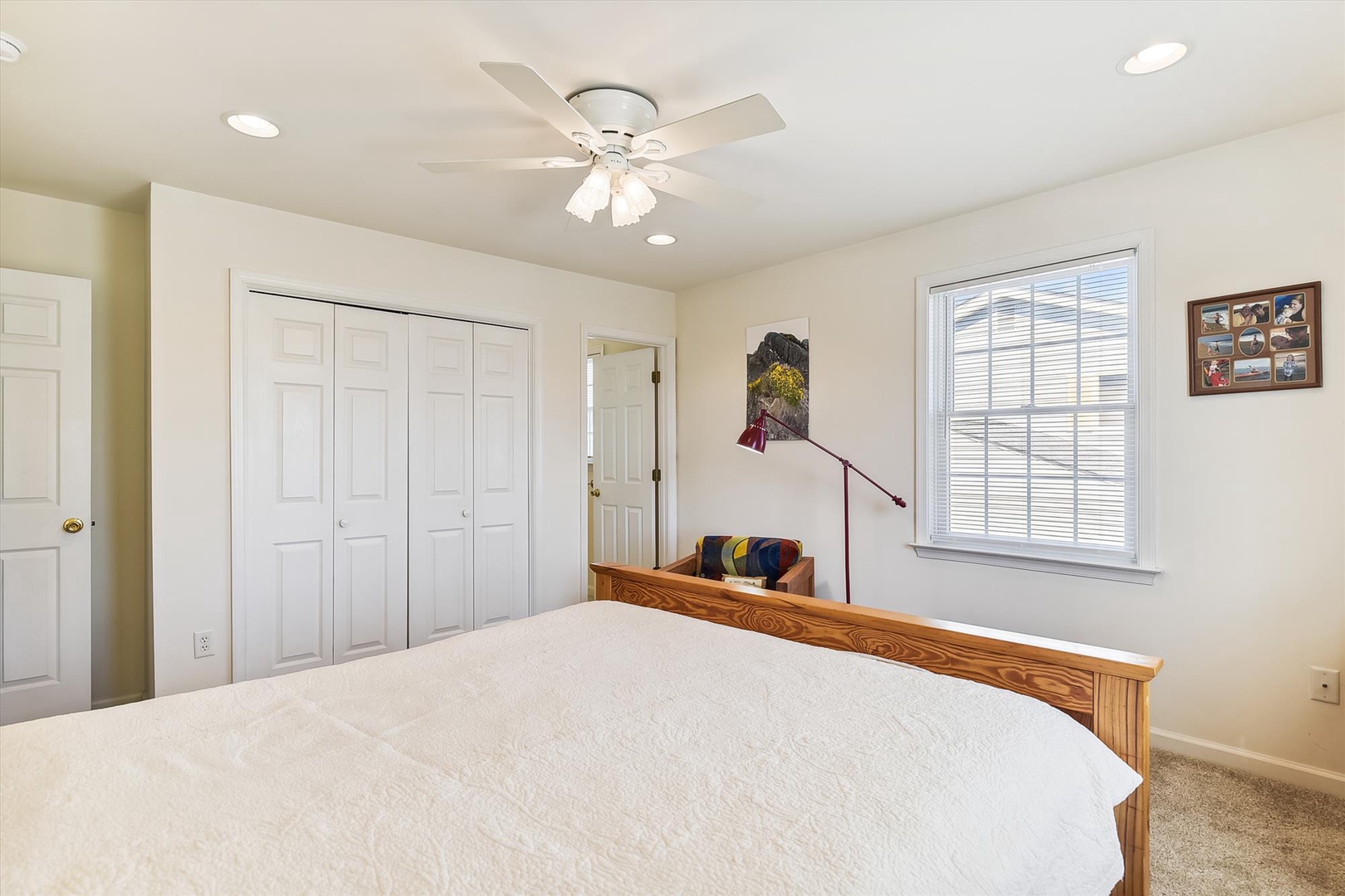 Your bright, peaceful bedroom features a cozy queen bed, ceiling fan, and plenty of storage space to settle in and unwind after a day exploring.