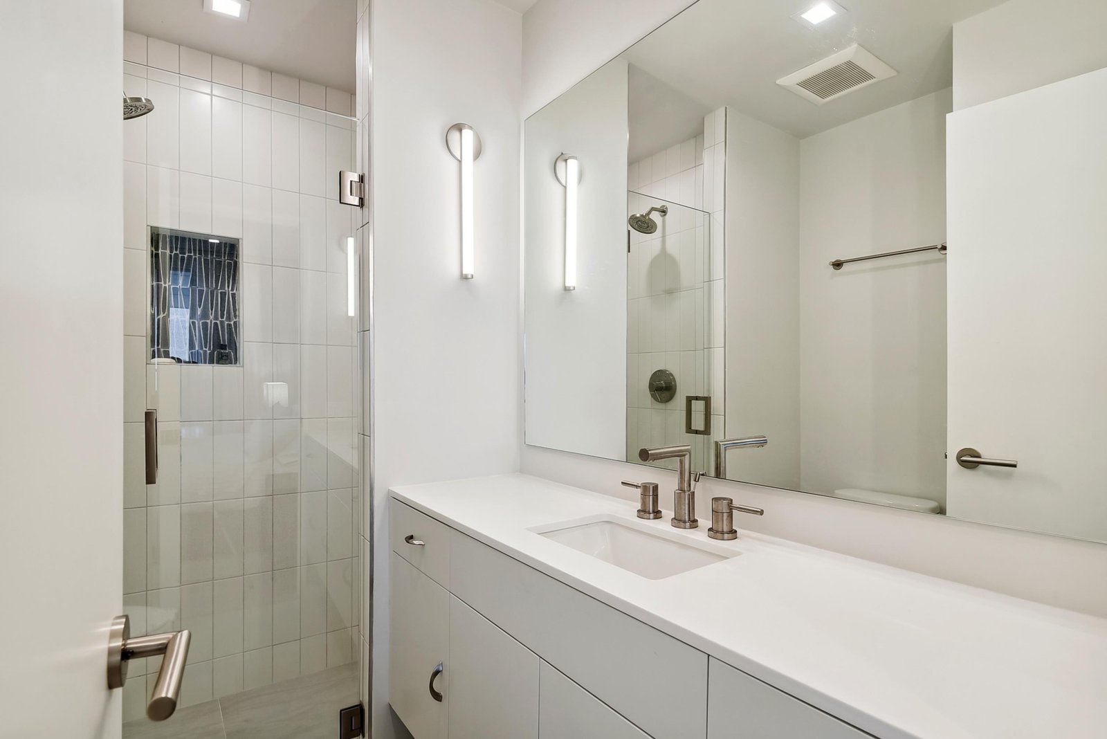 Step into your private spa-like bathroom, where clean lines and modern fixtures create a serene retreat after a day of exploring.