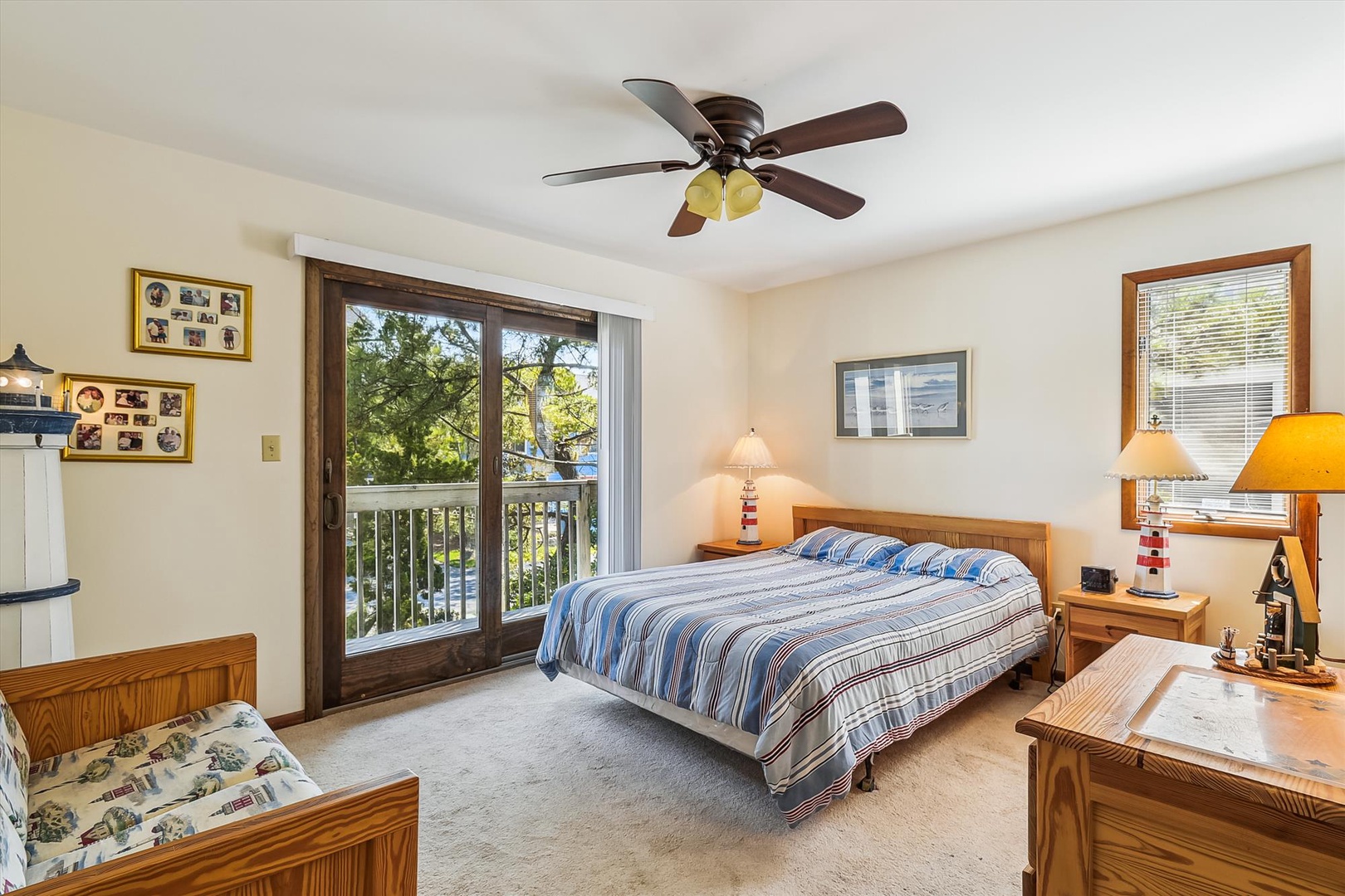 Step into your bright, airy bedroom where wooden accents and soft lighting create a cozy retreat. Wake to treetop views and gentle ceiling fan breezes.