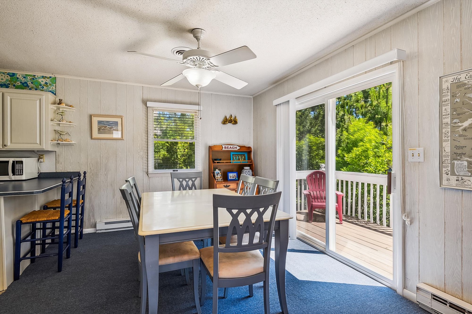 Enjoy meals with lush greenery views from your cozy dining area, opening to a private deck where morning coffee or evening relaxation feels effortlessly peaceful.
