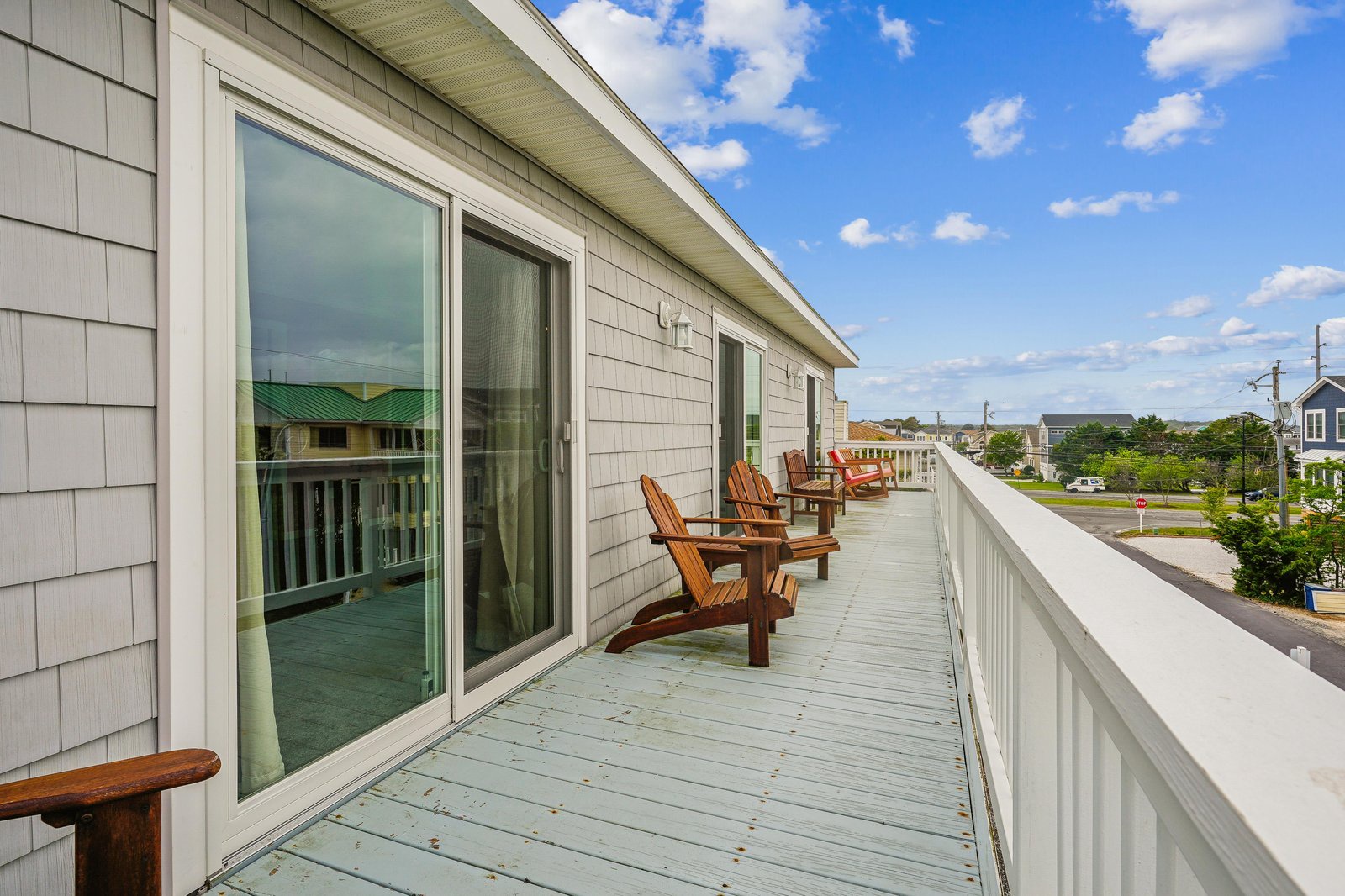 The spacious wrap-around deck offers ample room to unwind with Adirondack-style seating, perfect for morning coffee or evening stargazing under the coastal sky.