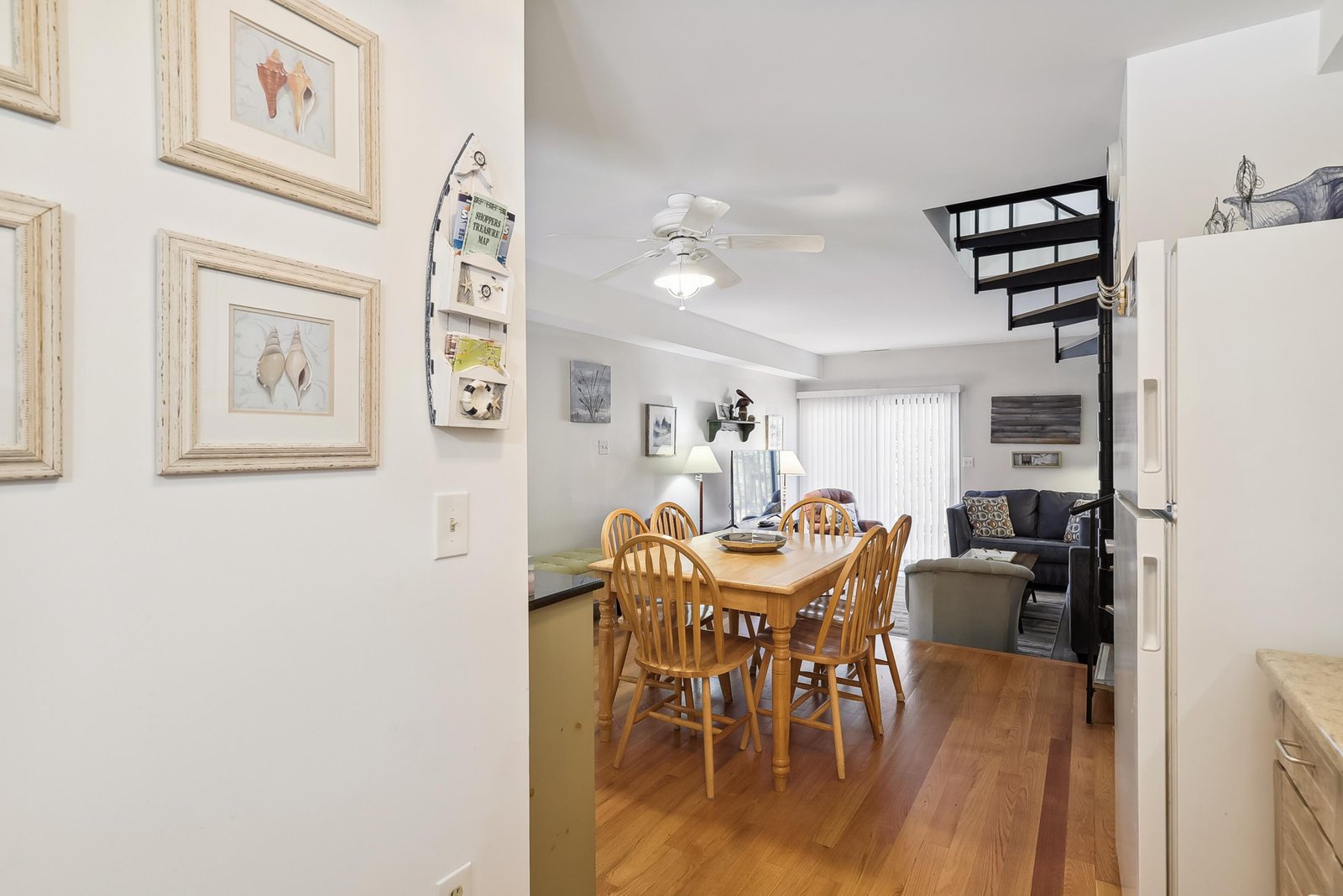 Step into your cozy beach escape with an open layout connecting dining, living, and lofted sleeping areas—perfect for gathering or unwinding after a day of adventure.