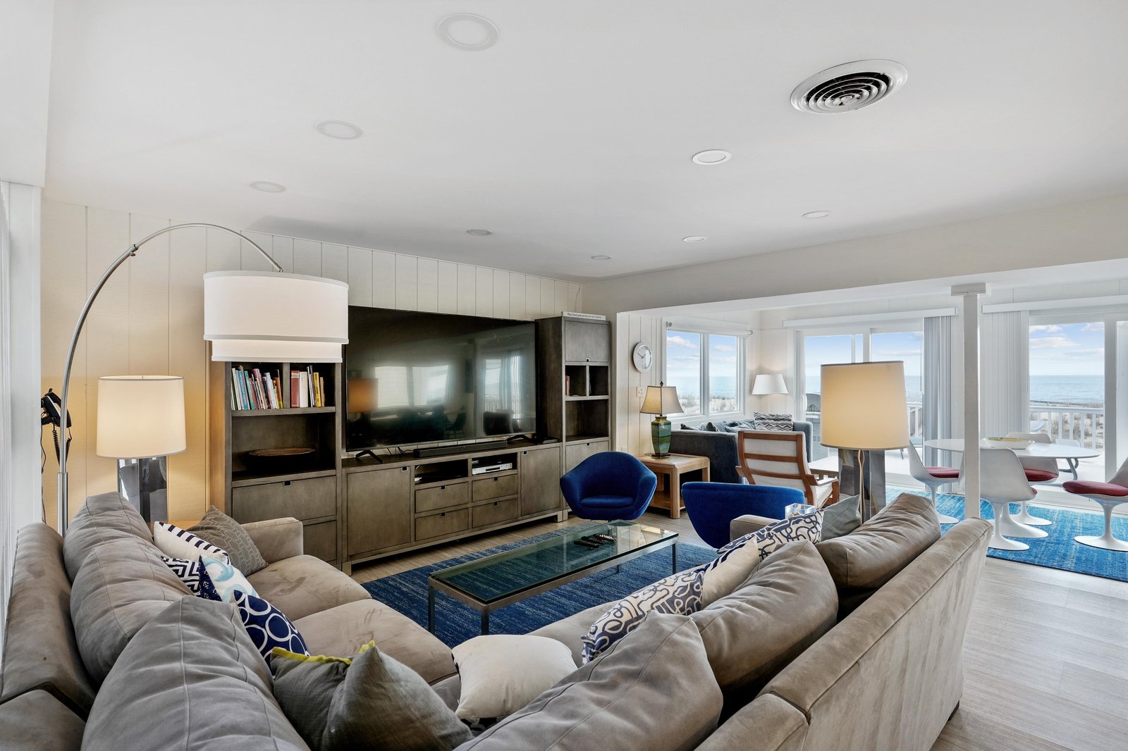 Unwind in this bright, open living space with sweeping ocean views from wall-to-wall windows. Sink into the plush sectional sofa and let the coastal breeze set the tone for your stay.