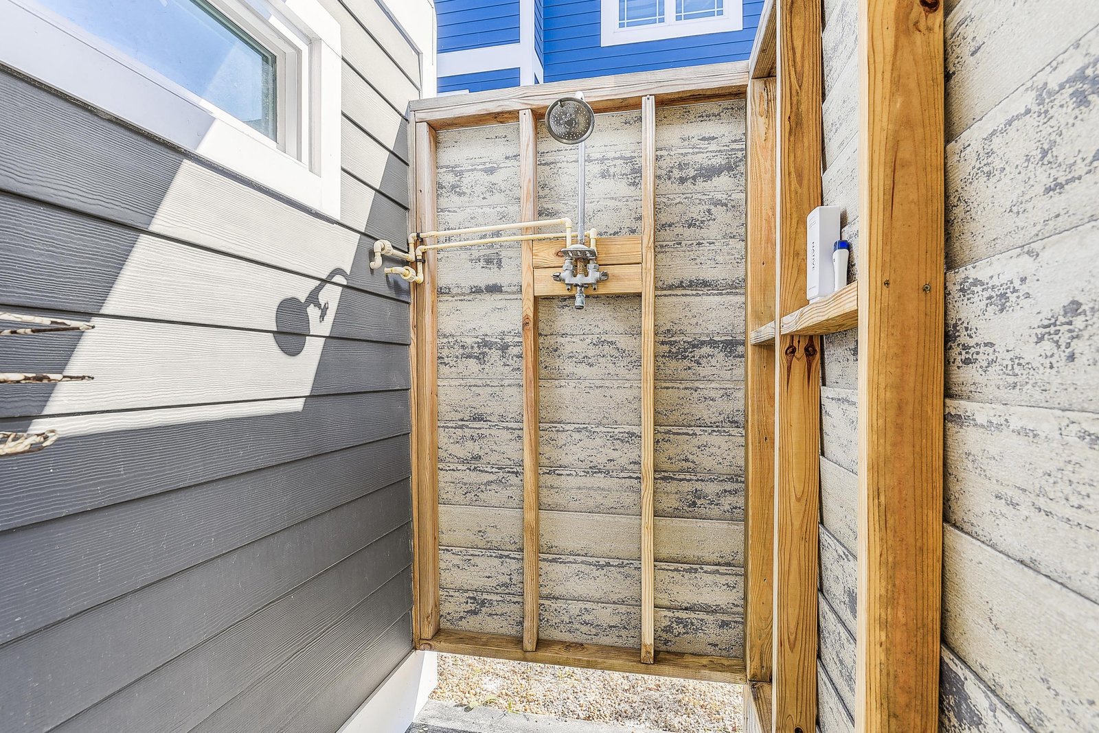 An outdoor shower provides a perfect spot to rinse off sand and salt after your beach adventures, keeping the inside of your space fresh and clean.